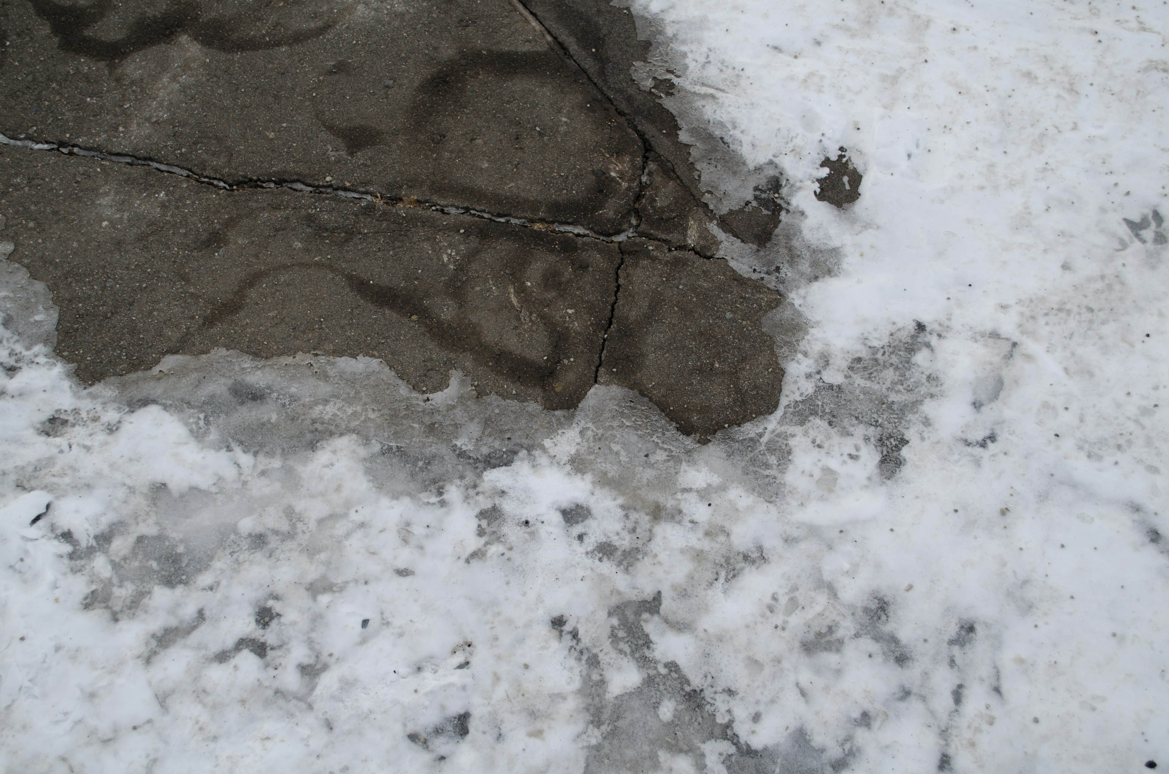 Detailed view of a rocky surface on snow and ice