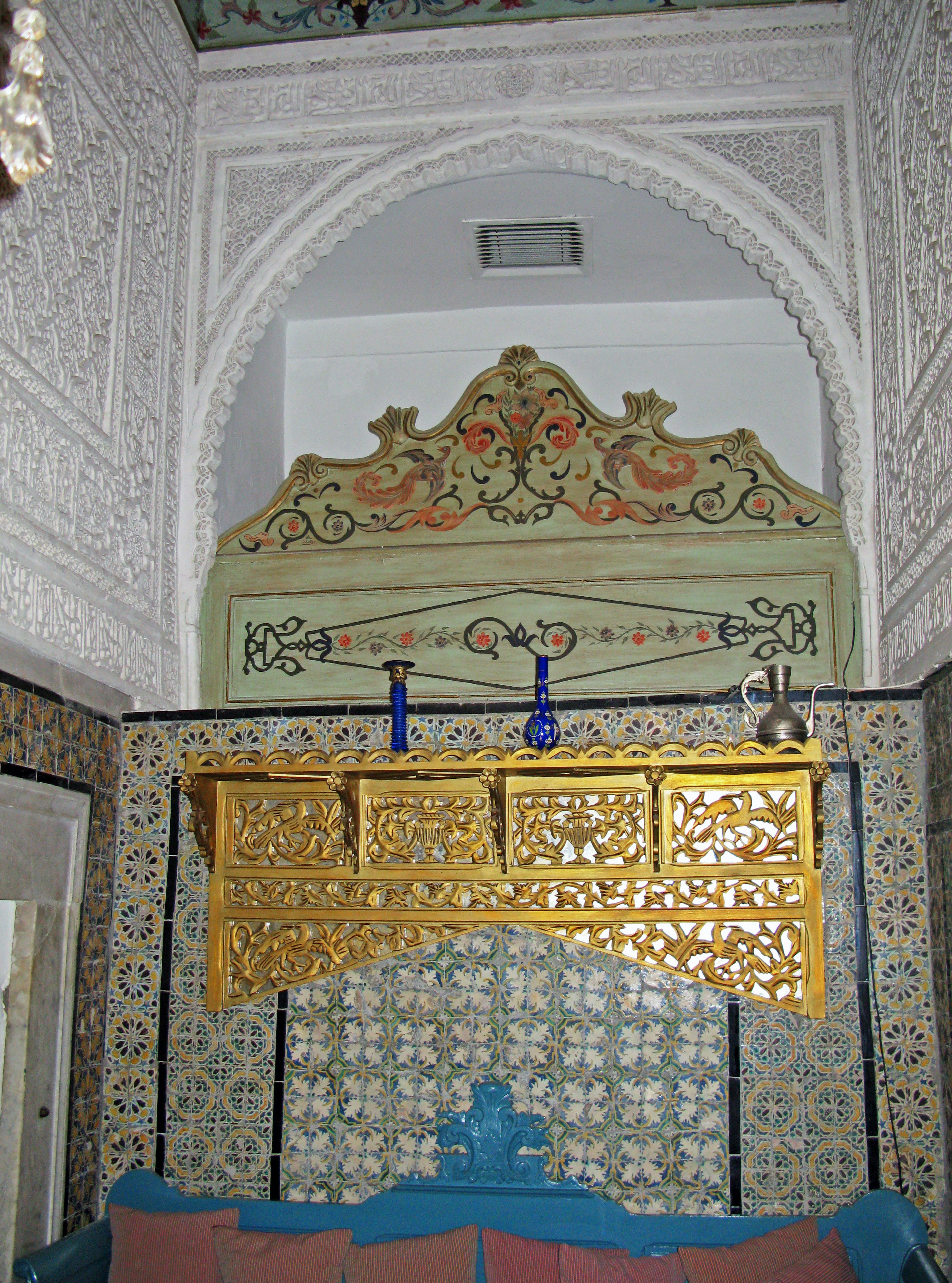 Interior of a room with ornate walls and golden decorative elements