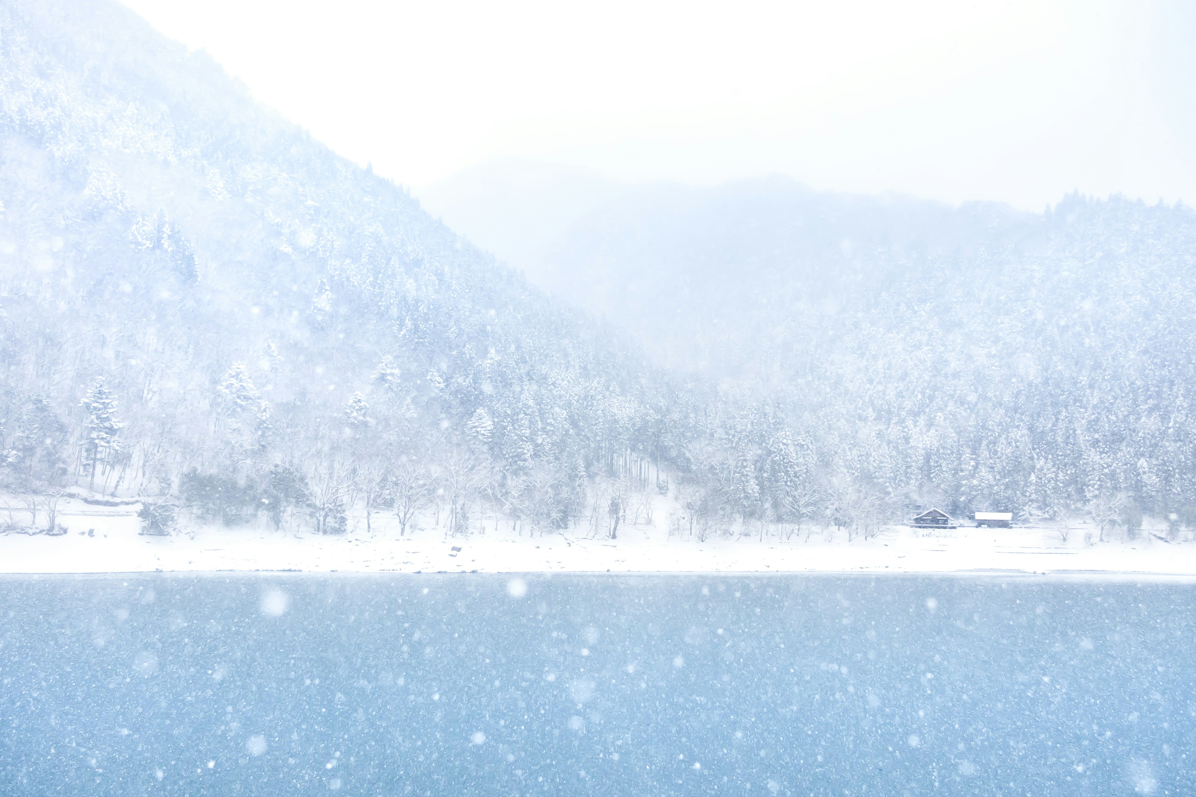 Snow-covered mountains and a tranquil lake view