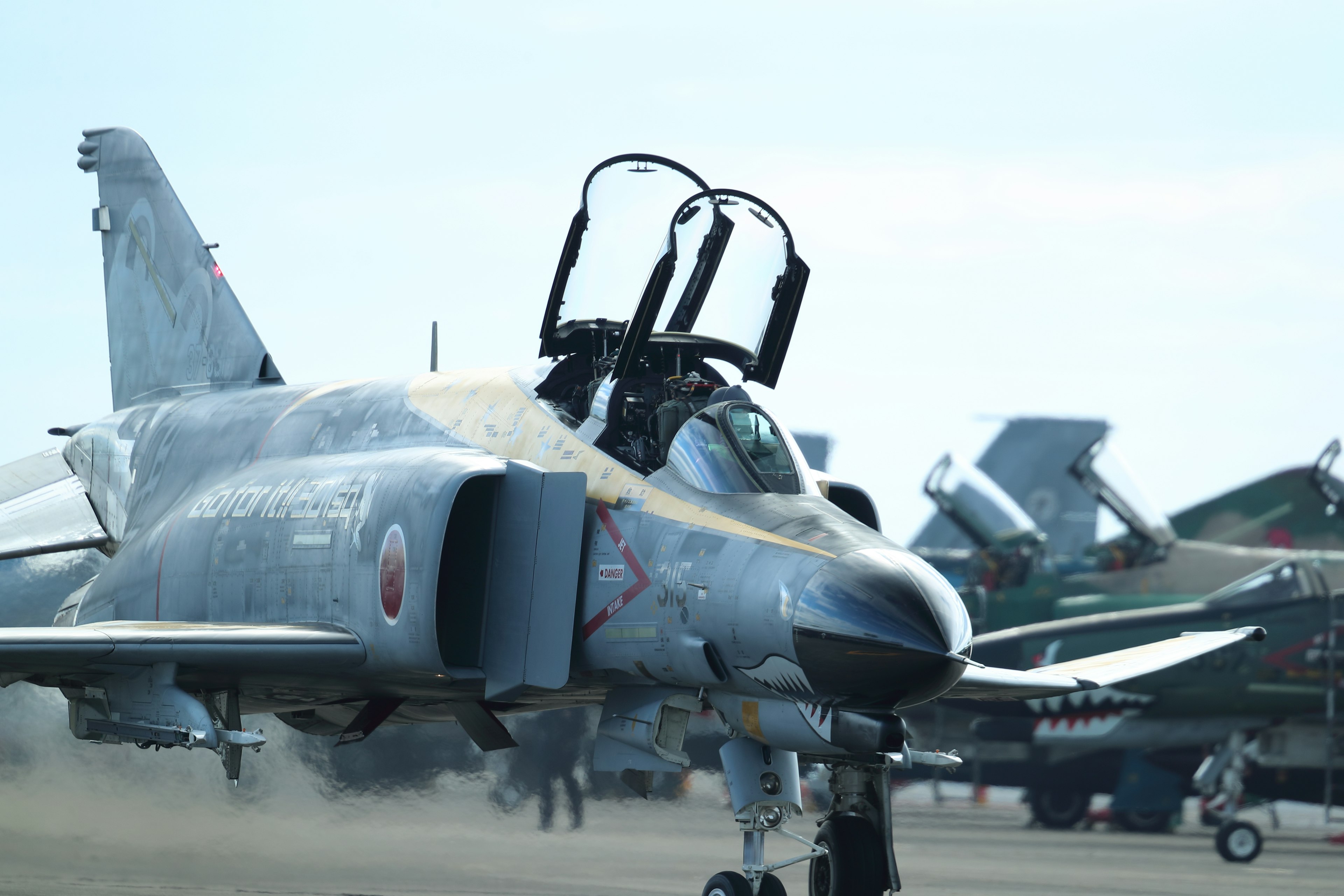 Image of a fighter jet with an open cockpit