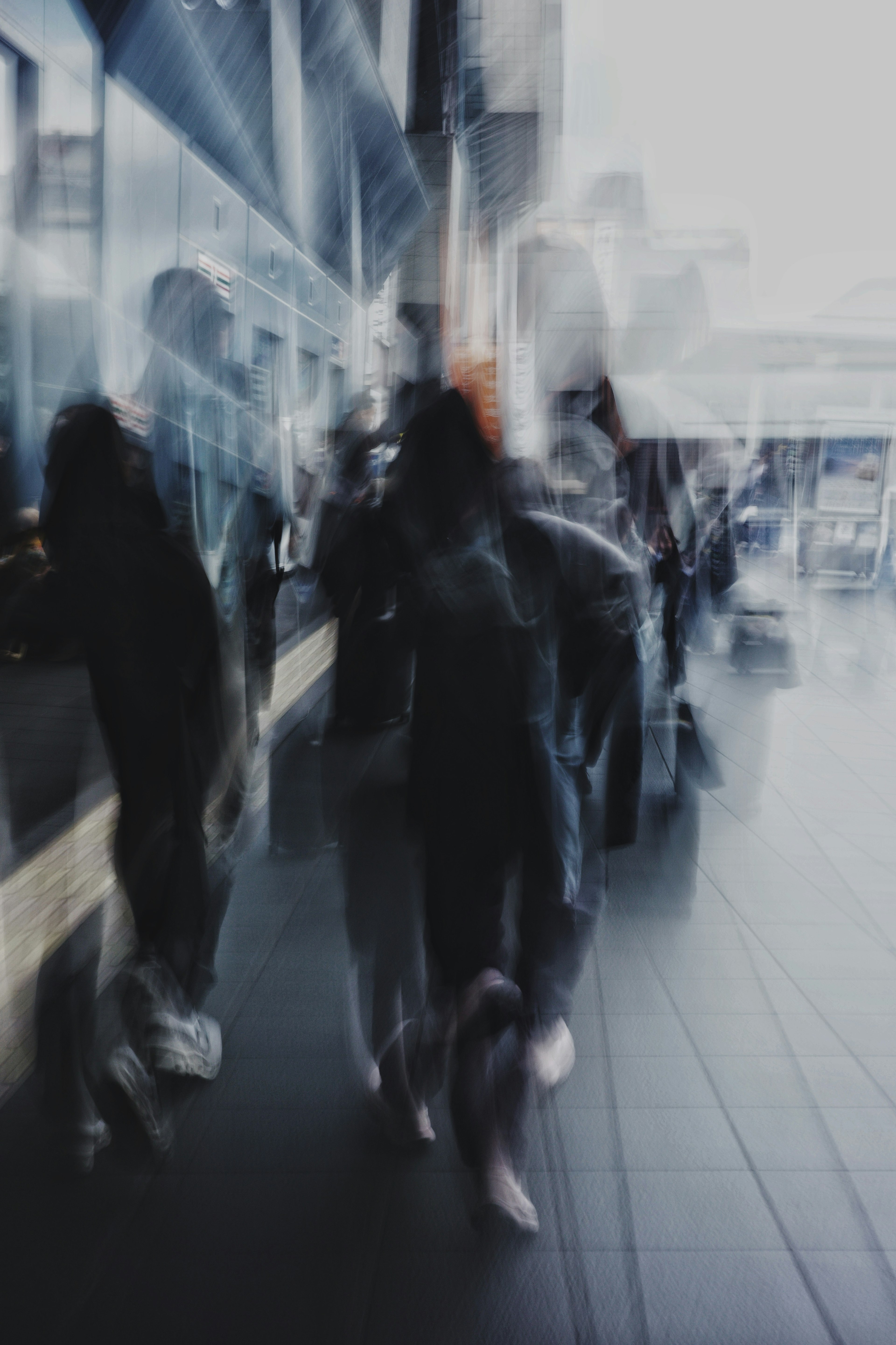 Blurred urban scene with people walking