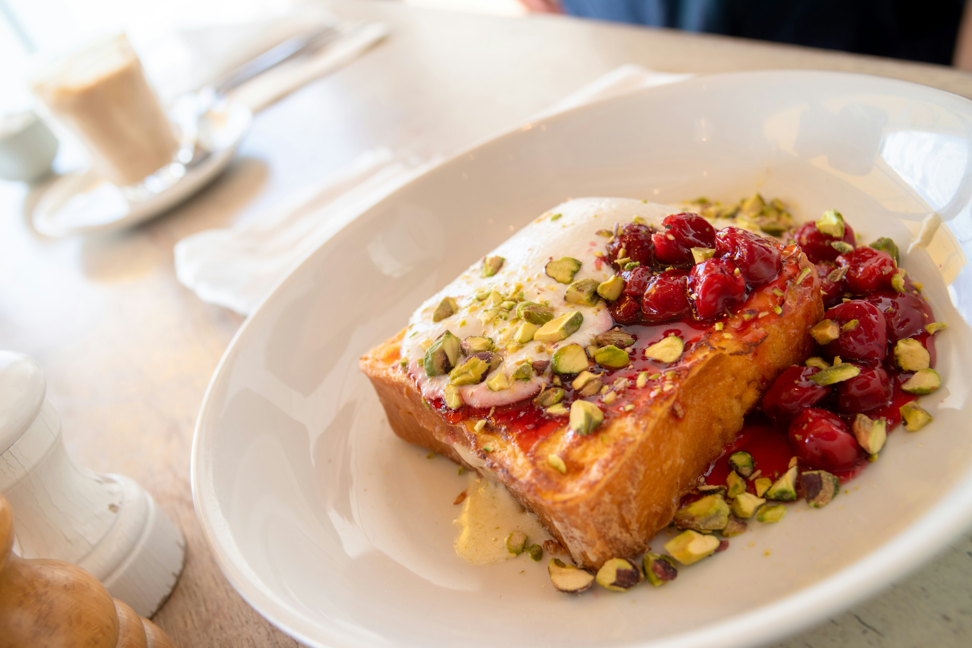 French toast topped with colorful nuts and berries