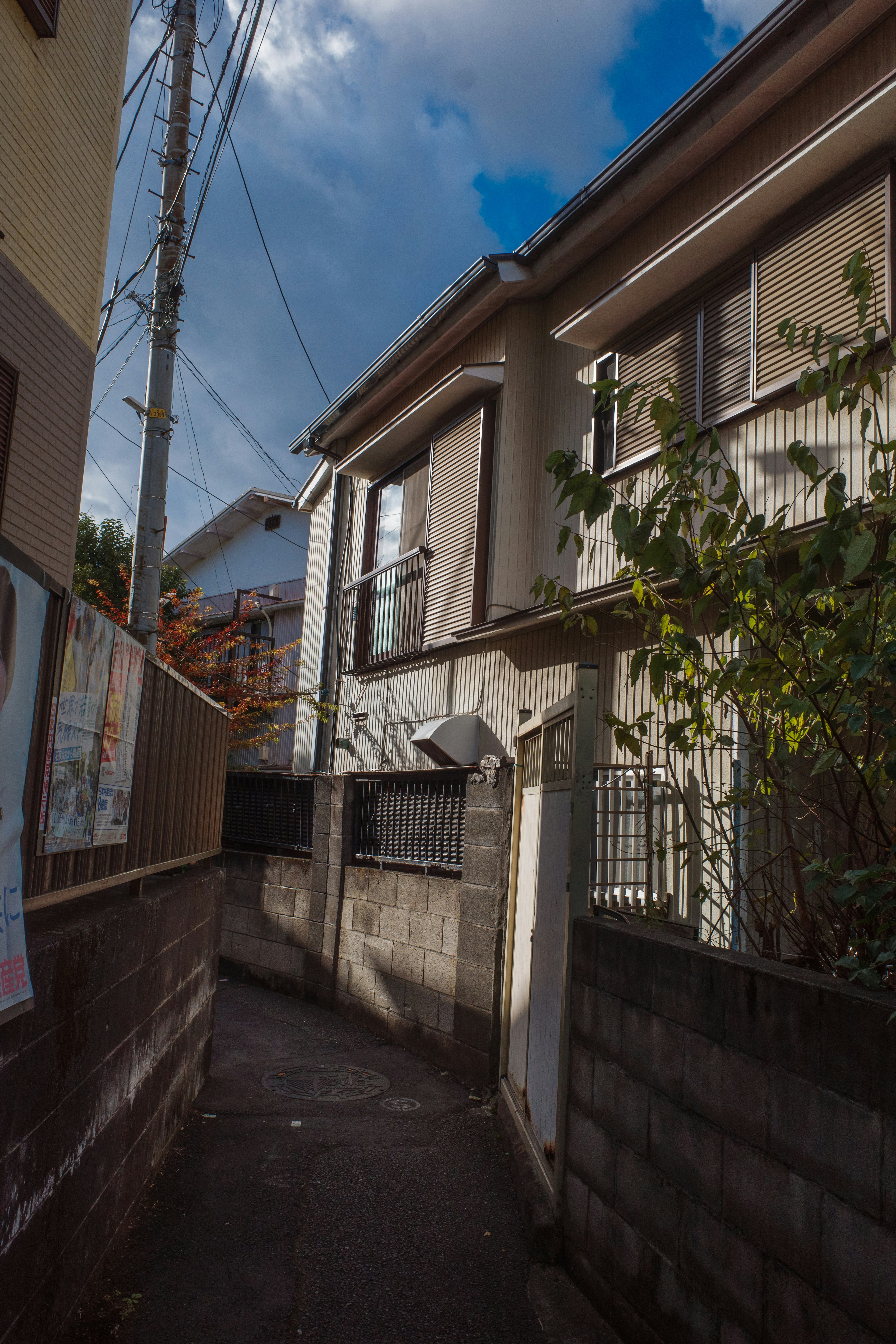 Narrow alleyway with buildings and blue sky