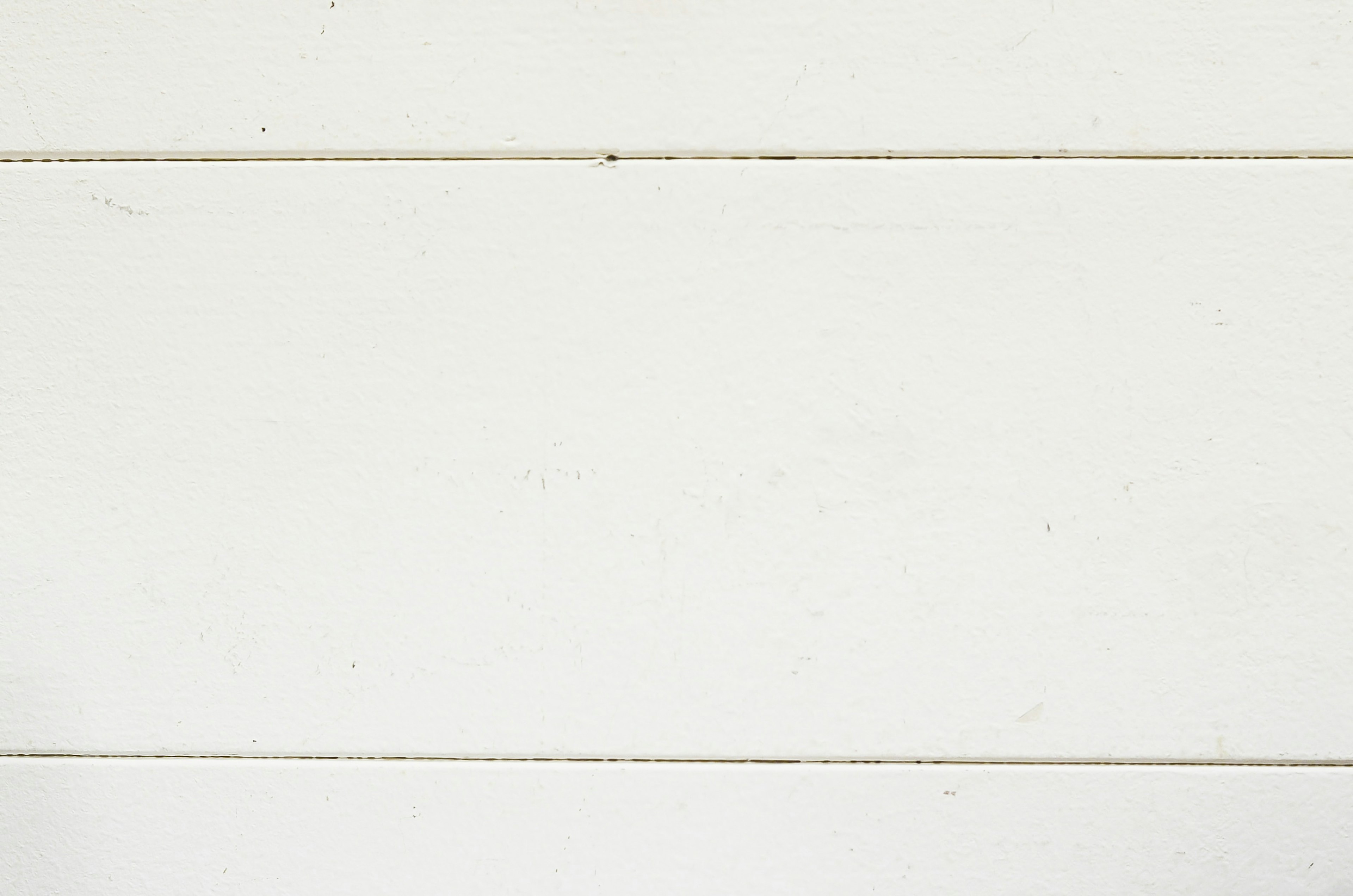 Textured white wooden planks arranged horizontally