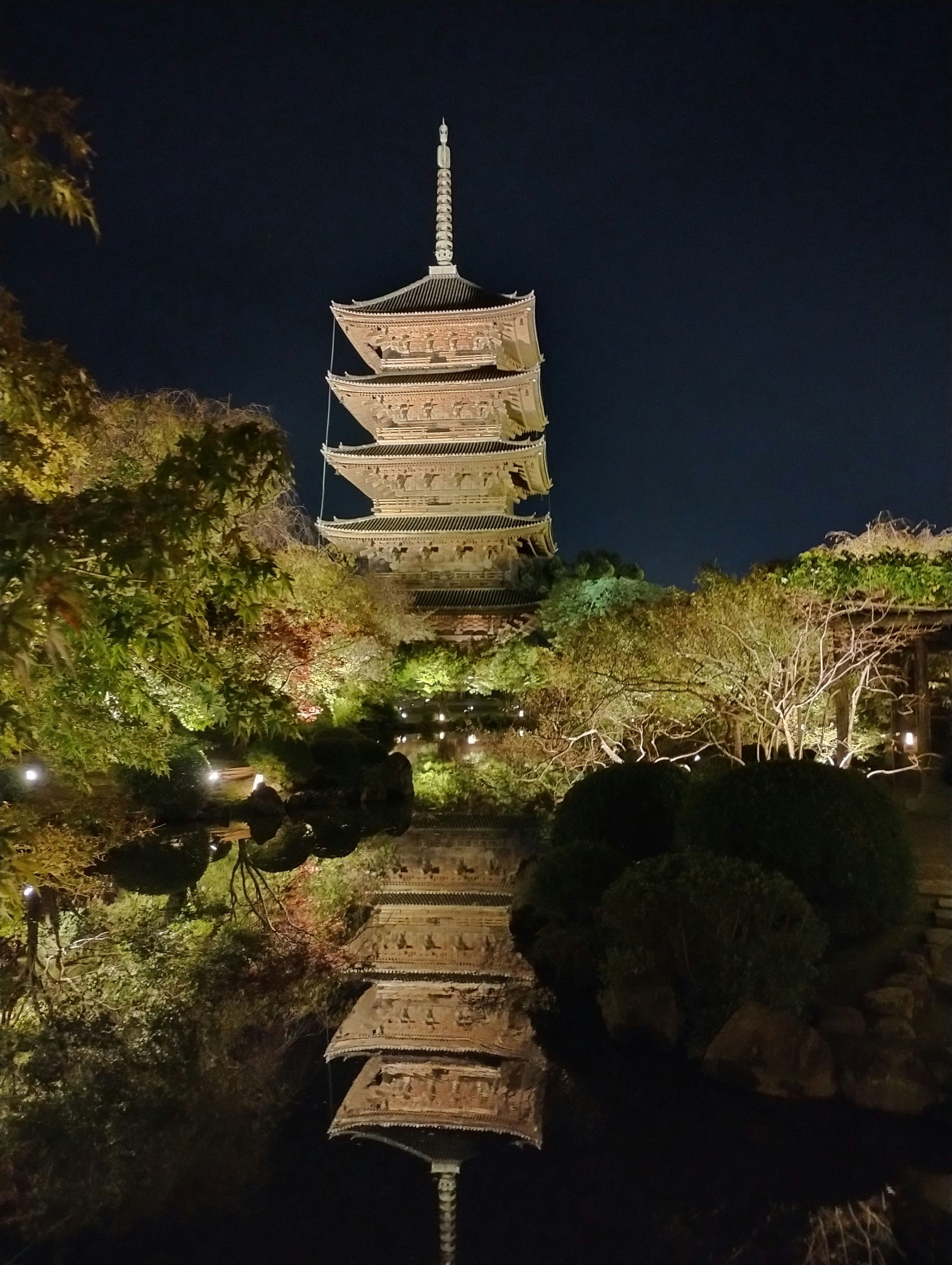 Beautiful view of a pagoda reflecting in the pond at night