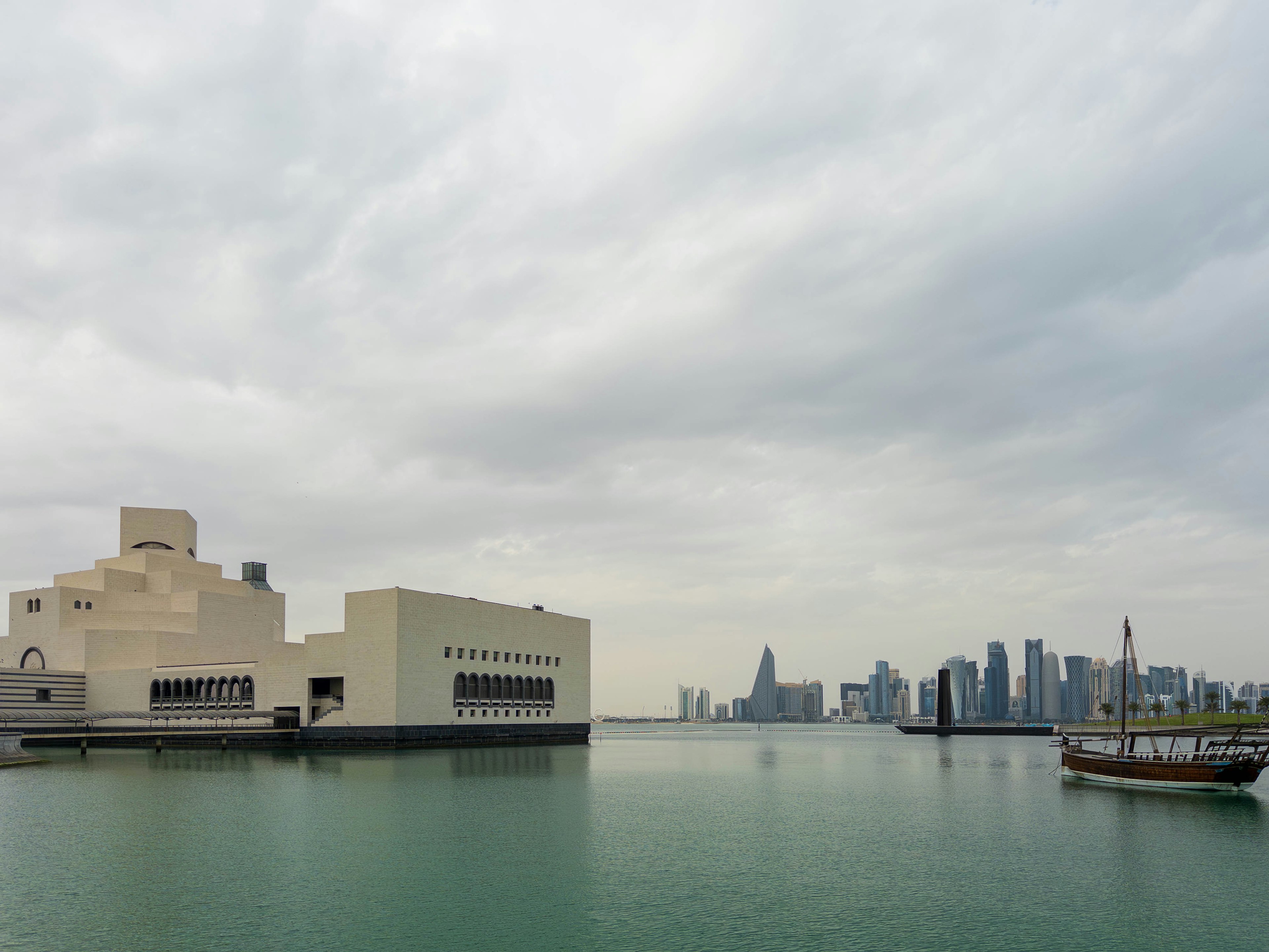 Modern building along Doha waterfront with skyline in background