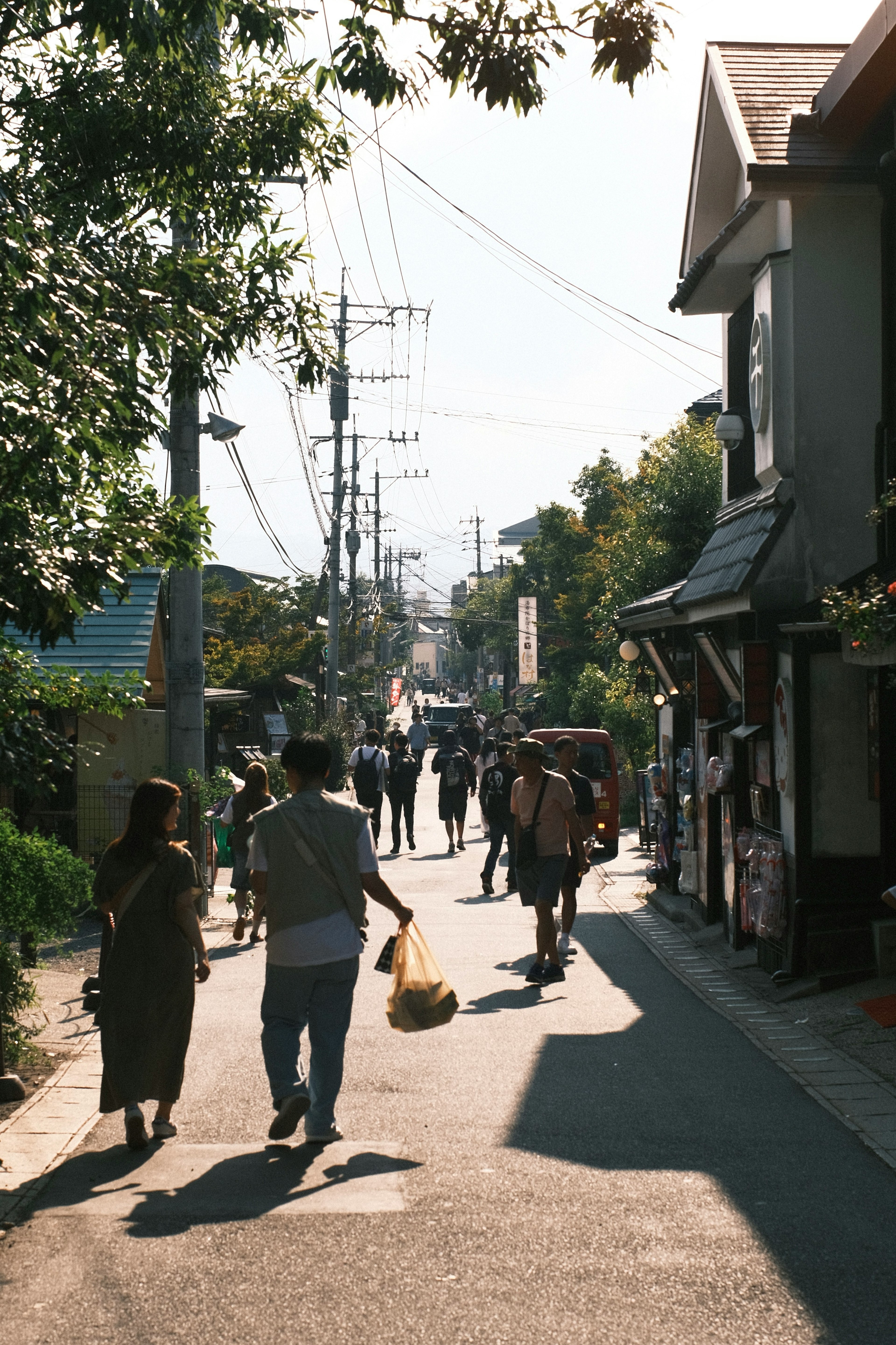 A serene street scene with people walking