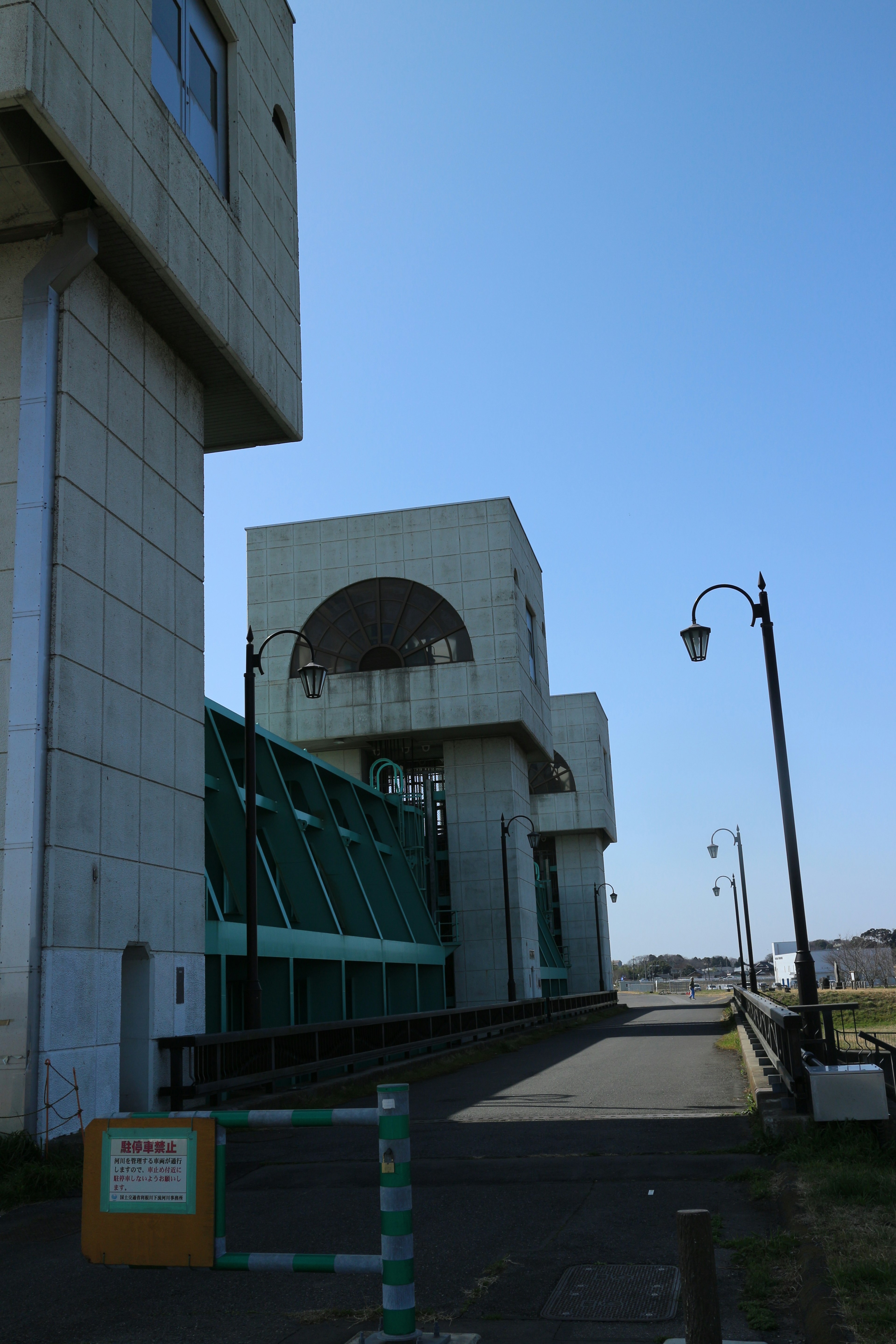 Modern building and streetlight under a clear blue sky