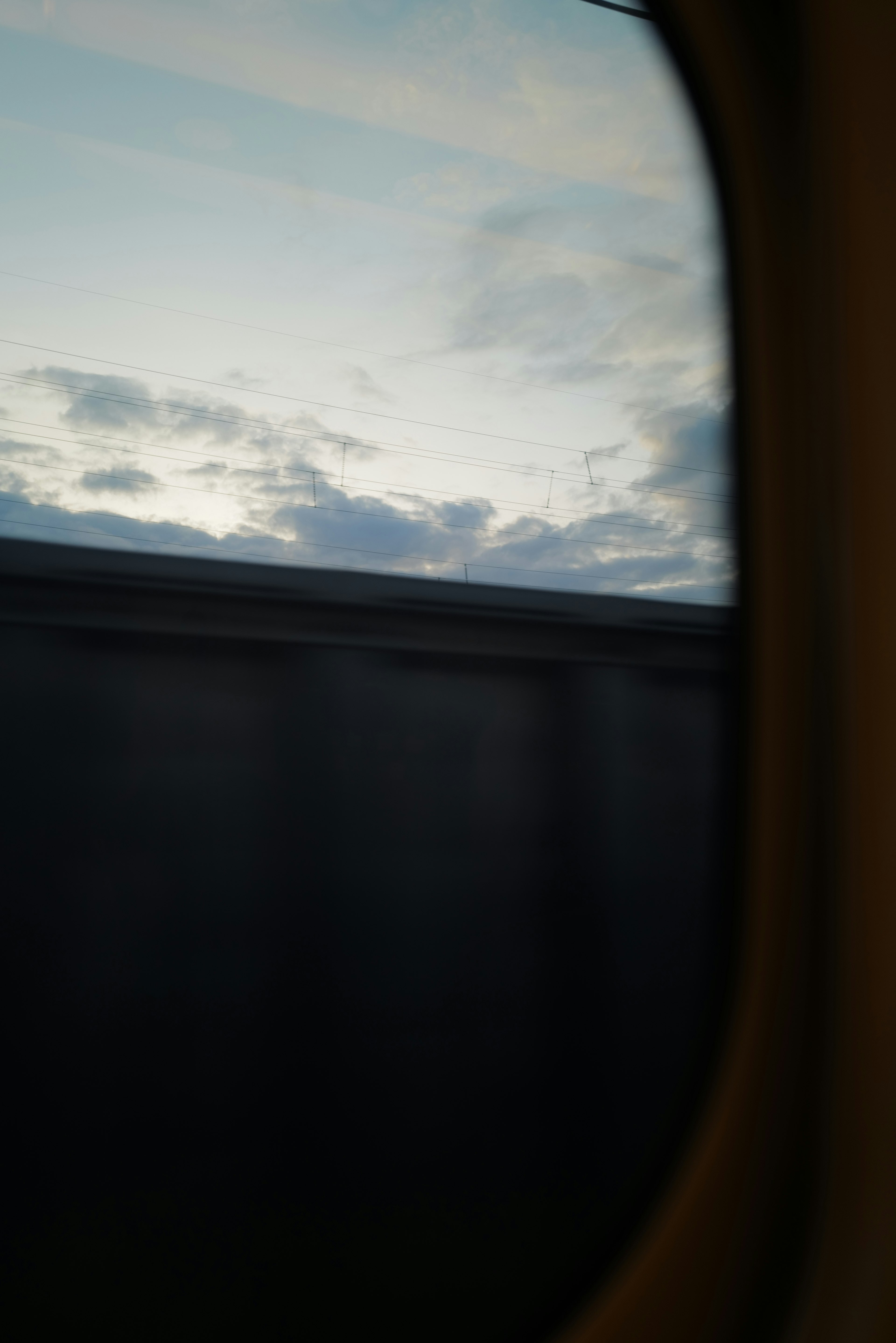 View of the sky and clouds from a train window