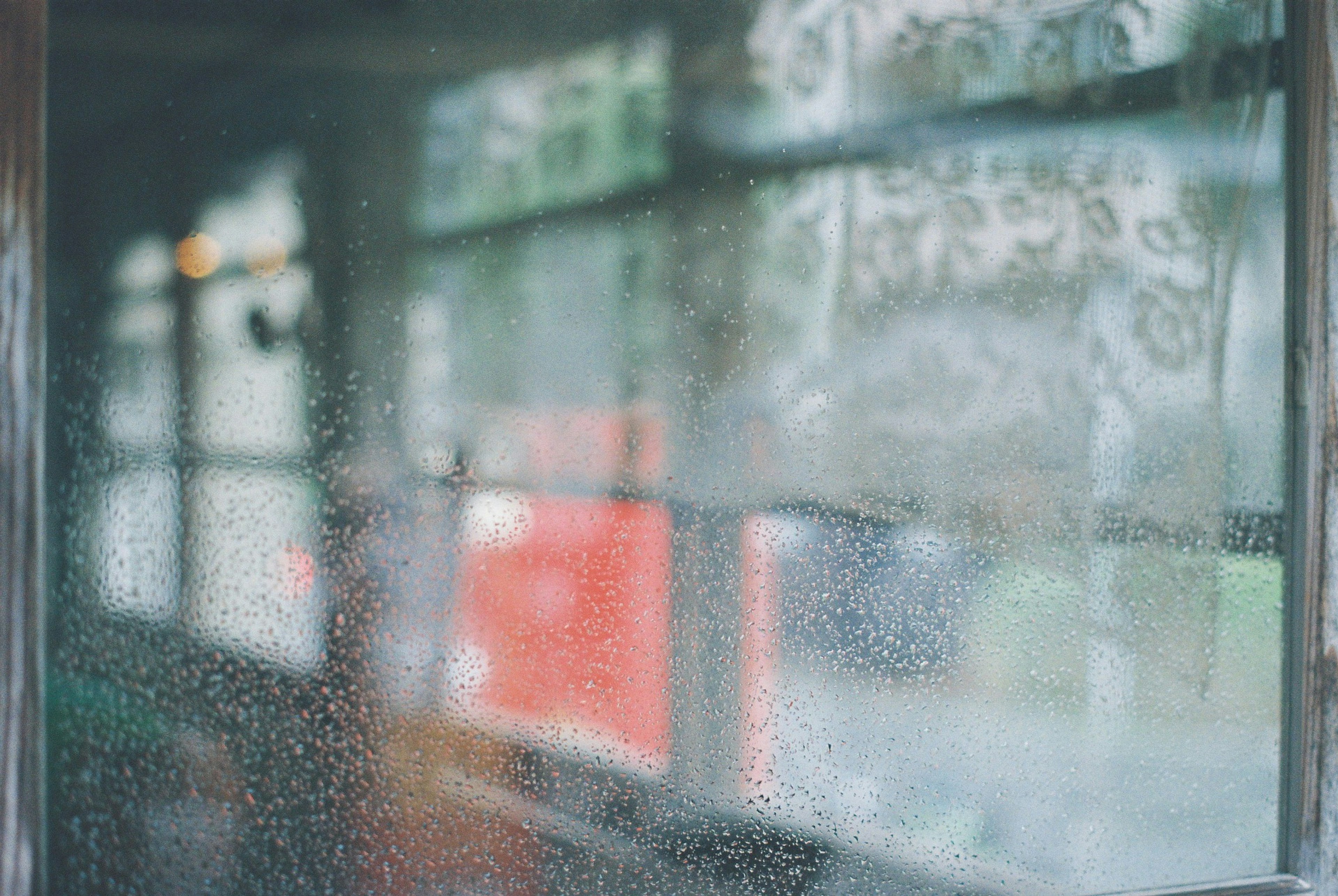 Foggy window with blurred view and soft background