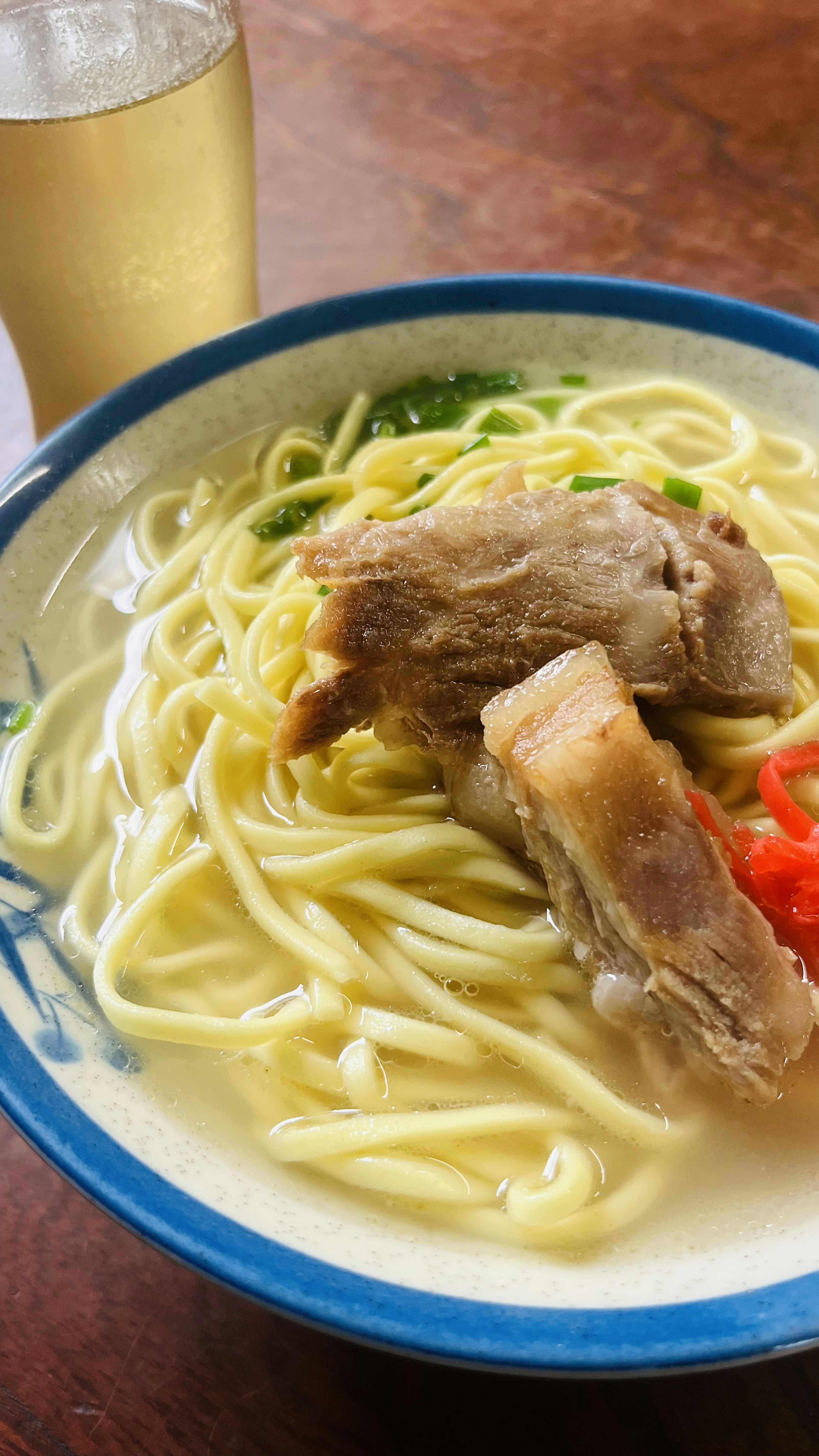 Bowl of ramen with broth and pork