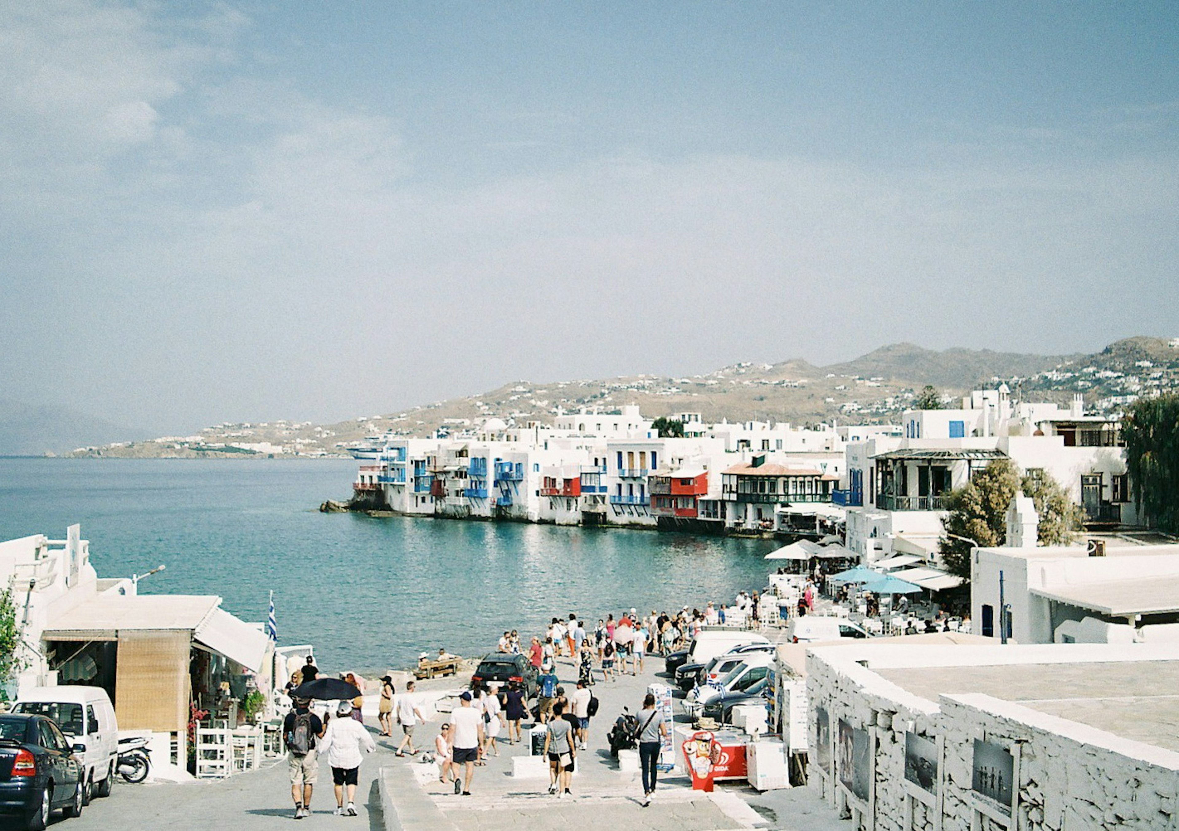 Beautiful Aegean Sea view with colorful houses lining Mykonos coastline