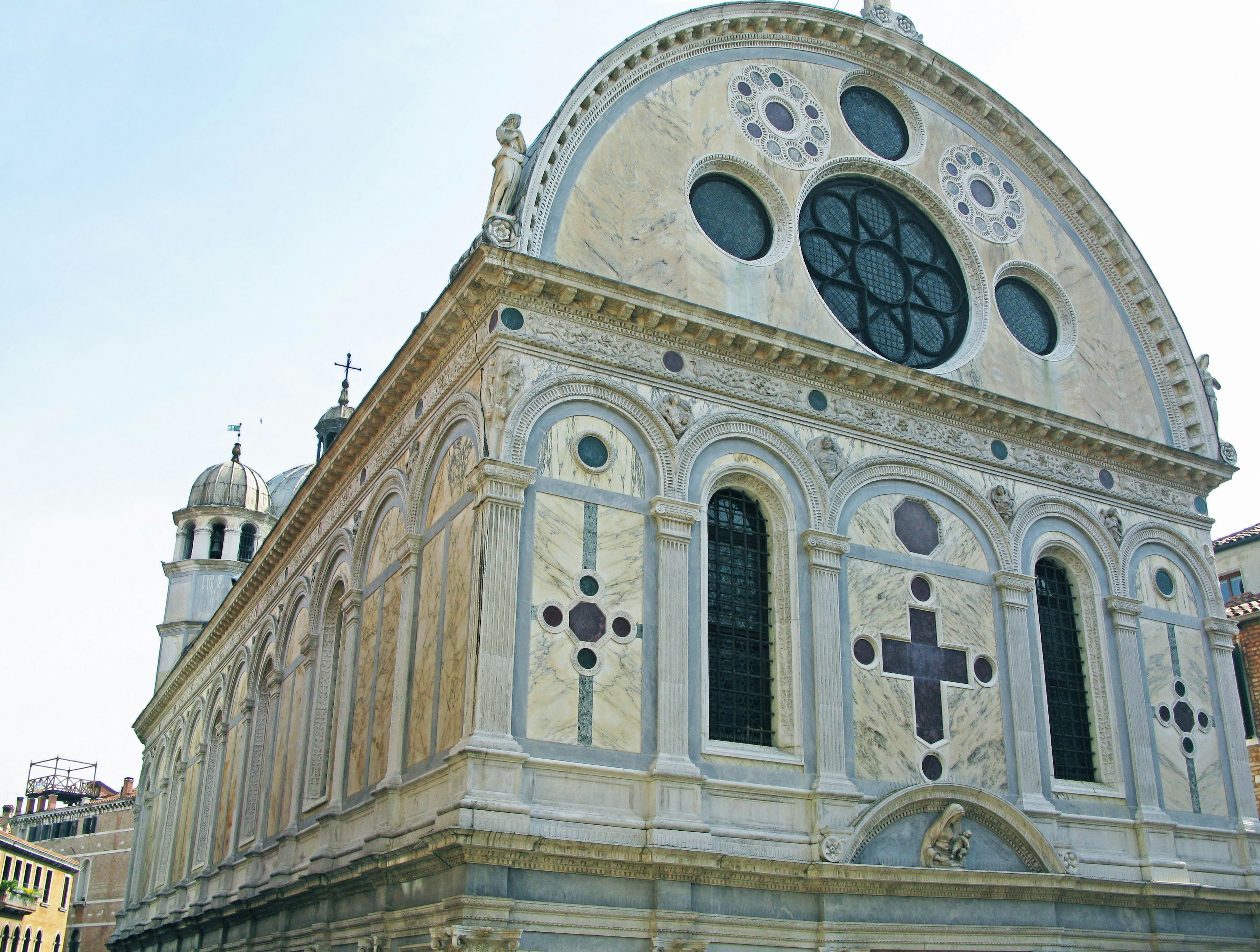 Beautiful church exterior with distinctive round window decorative facade historic Italian architecture