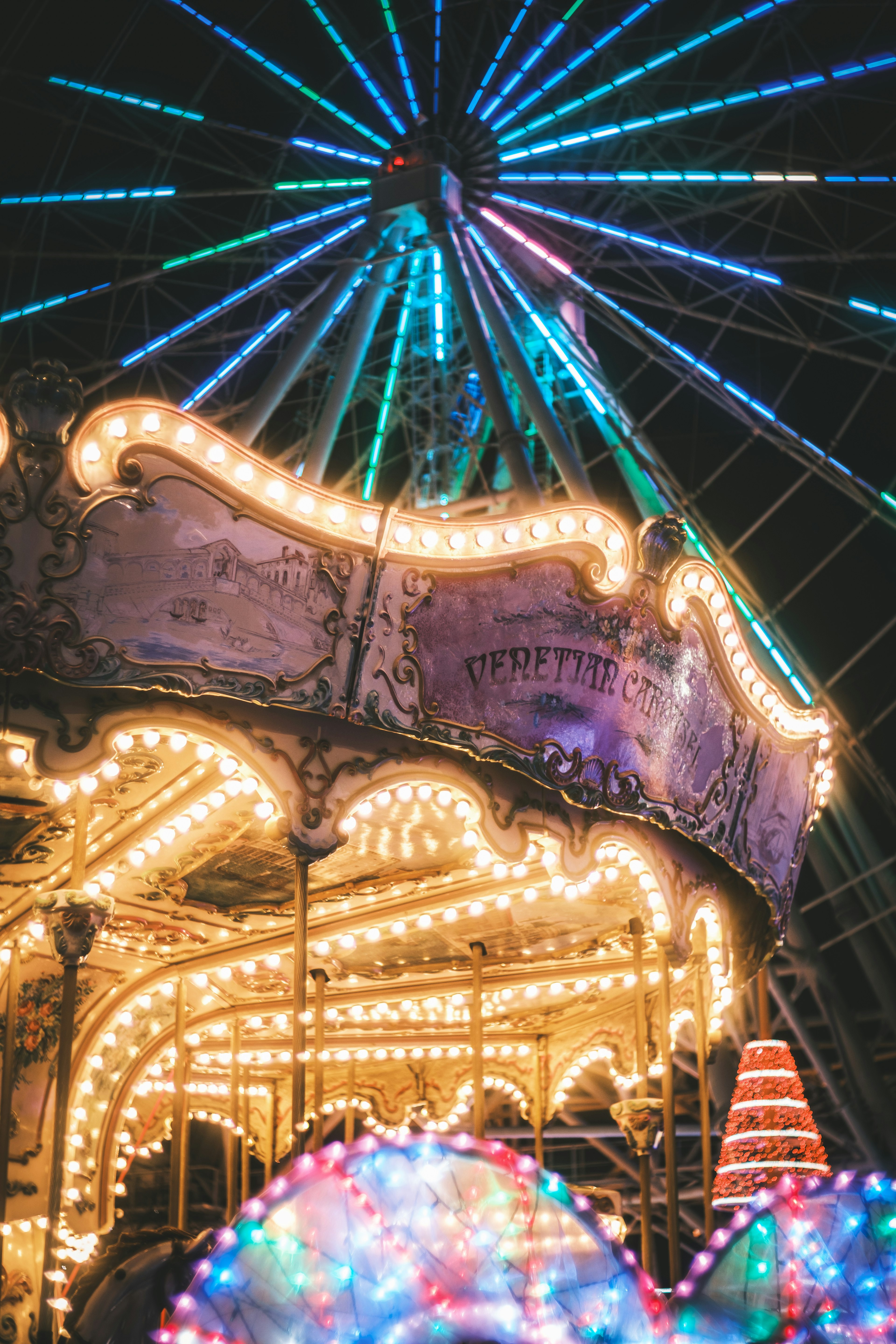 Colorful illuminated carousel at night with vibrant lights