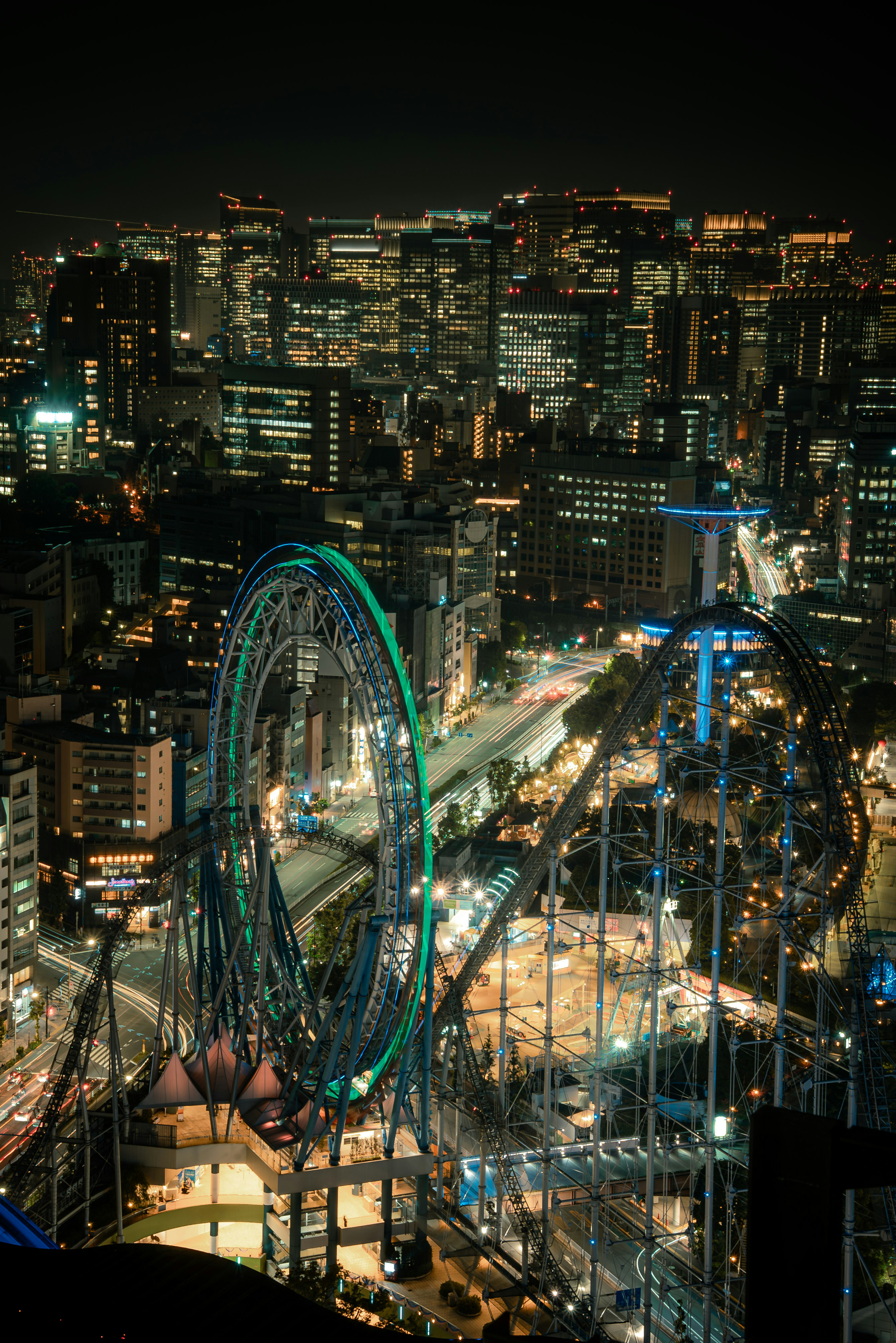 Beautiful night cityscape with a glowing Ferris wheel