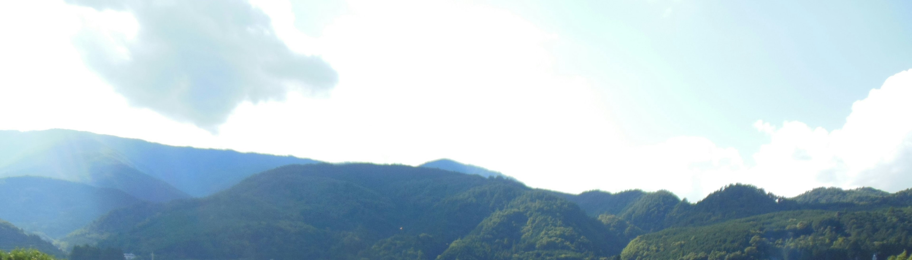 Scenic view of blue mountains and sky