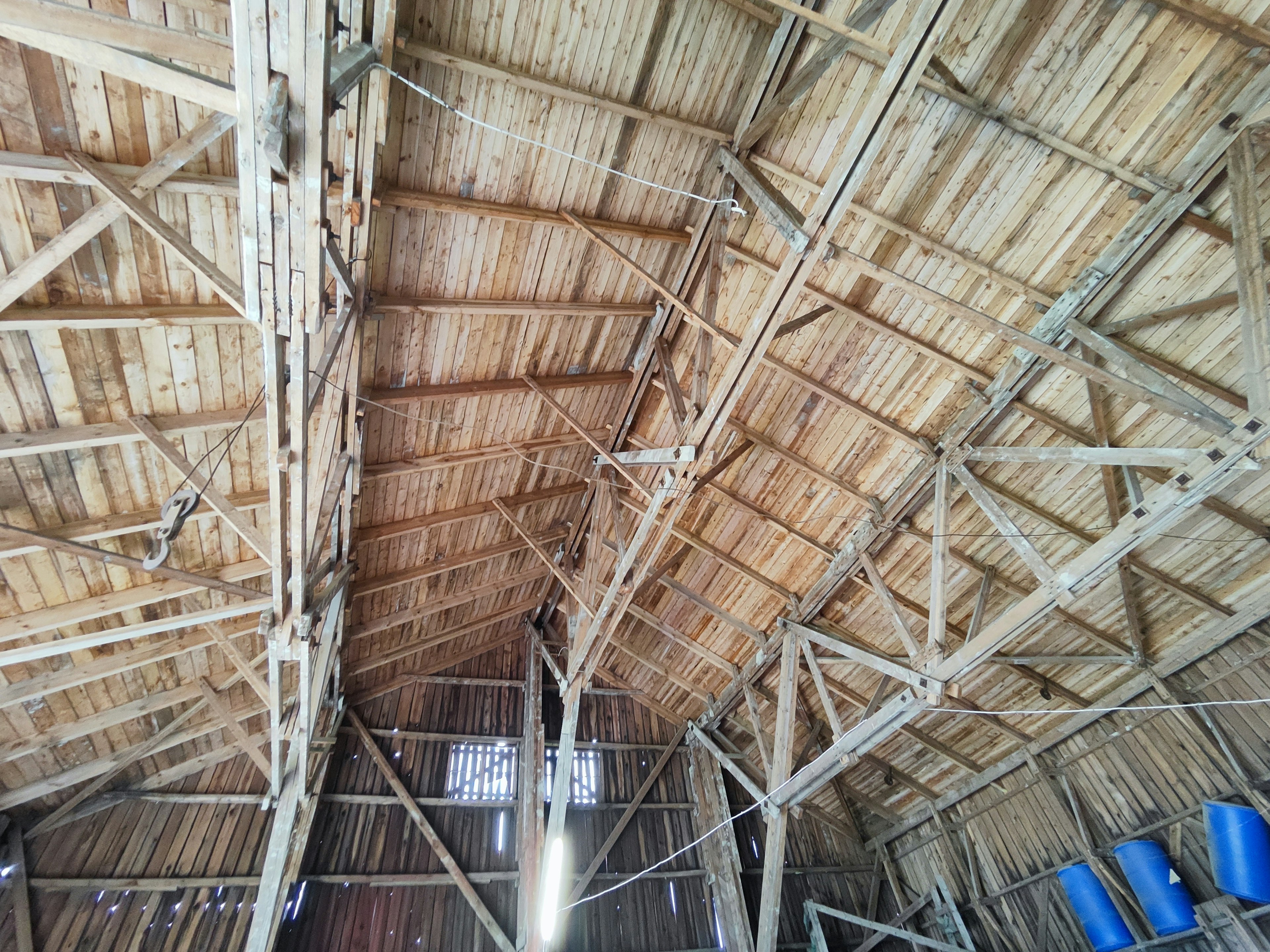 Interior view of a spacious roof made of wood and bamboo