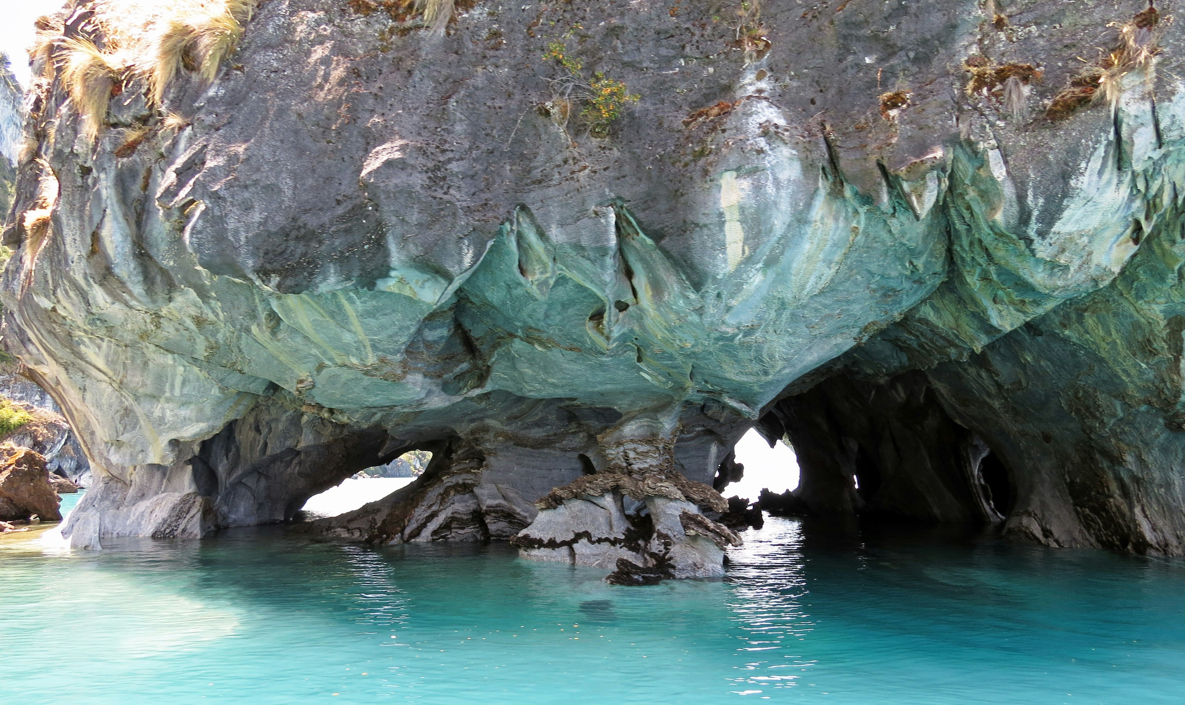 Cave with unique rock formations and turquoise water