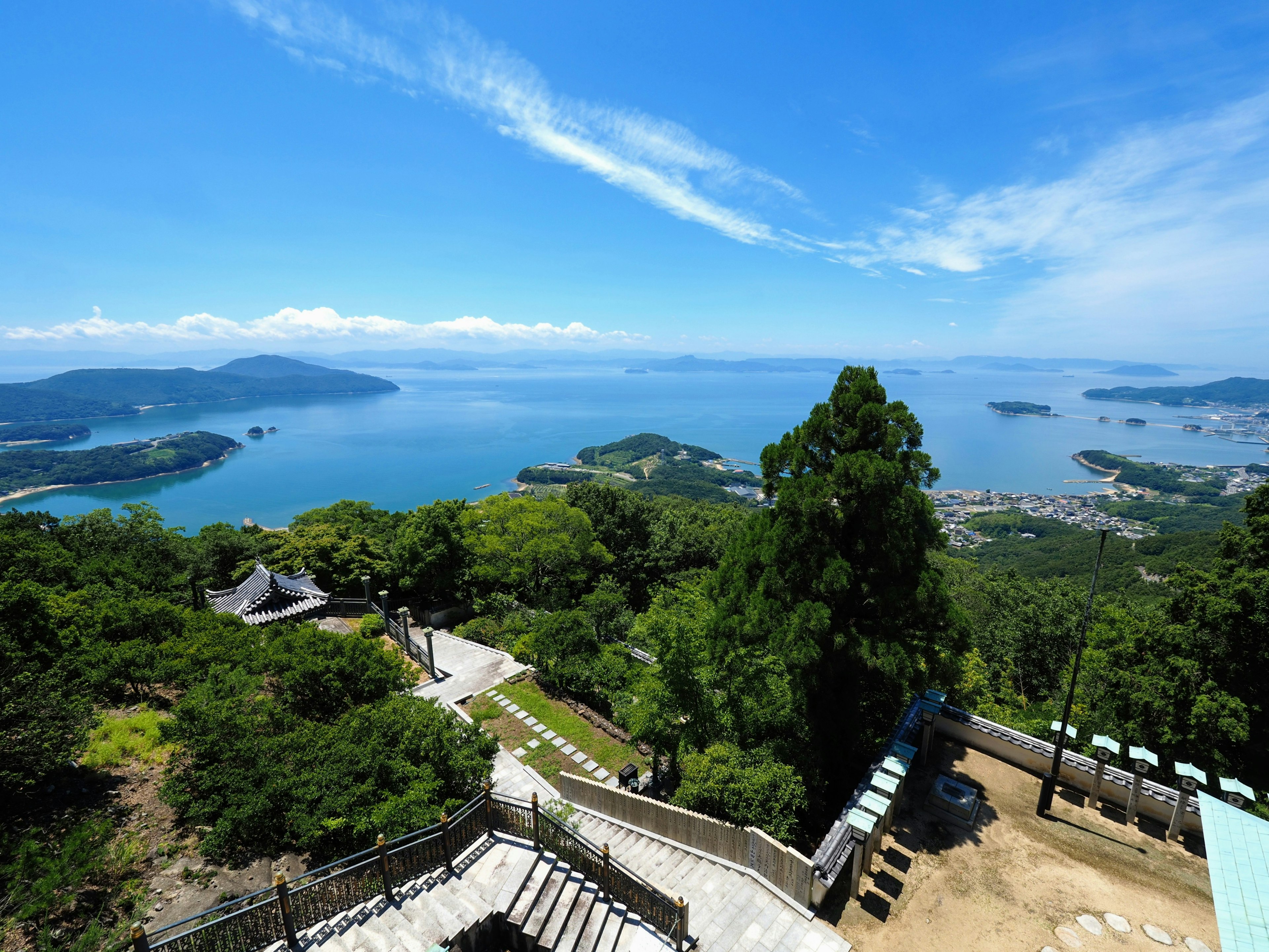 Scenic view from a lookout point overlooking the ocean and mountains