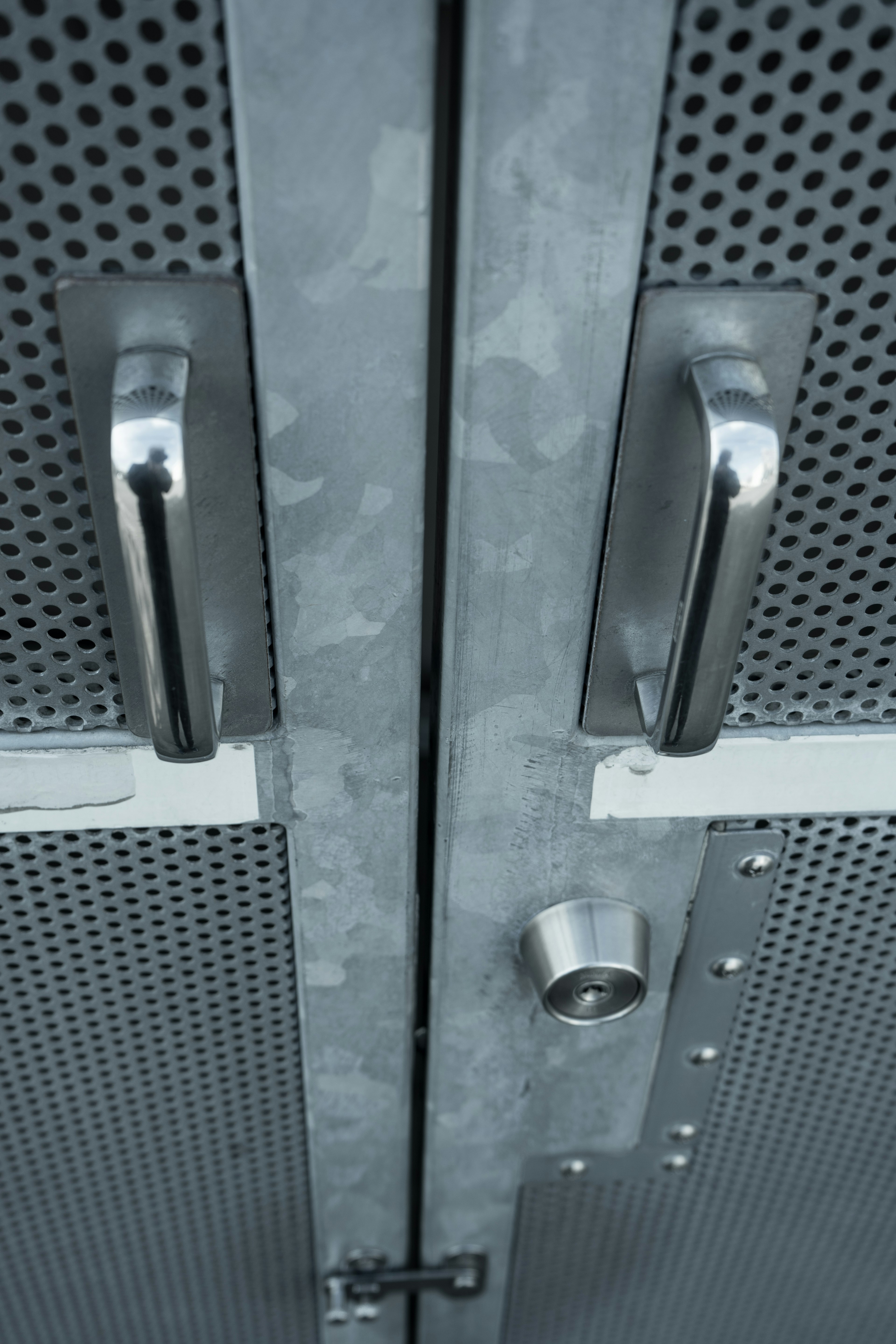 Close-up of metallic door handles and lock