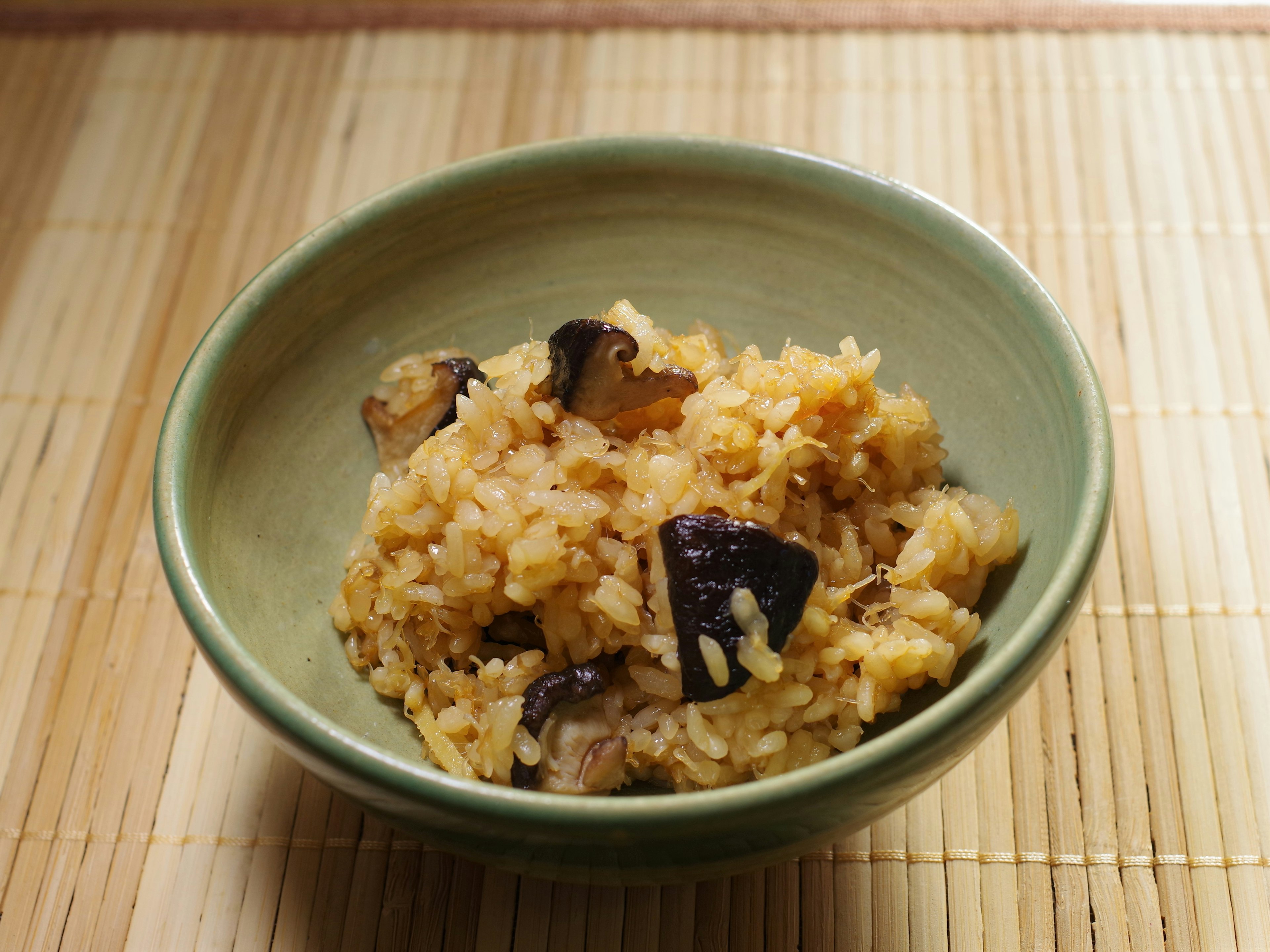 Delicious takikomi gohan served in a green bowl