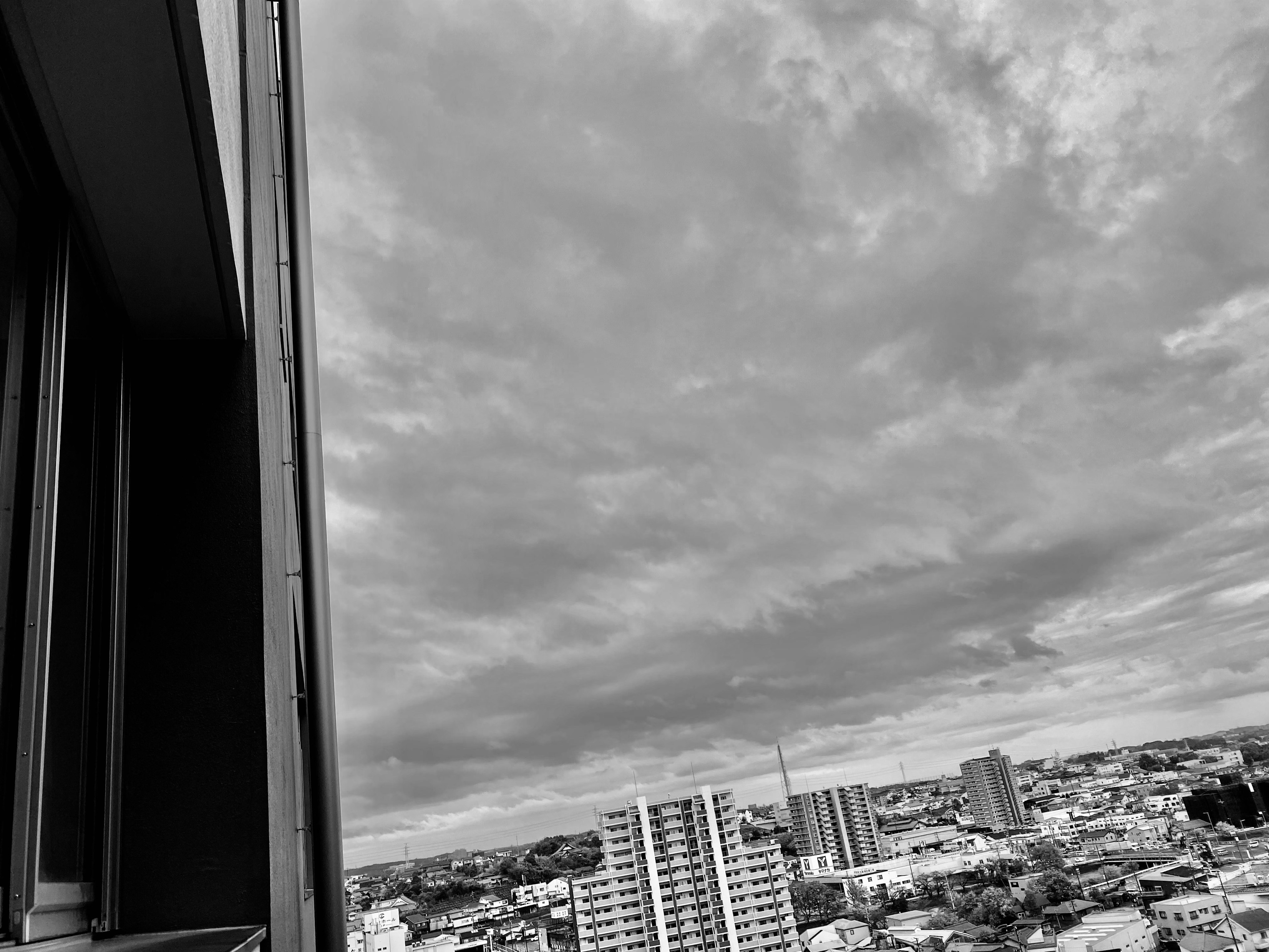 Black and white view of a cityscape from a high-rise building