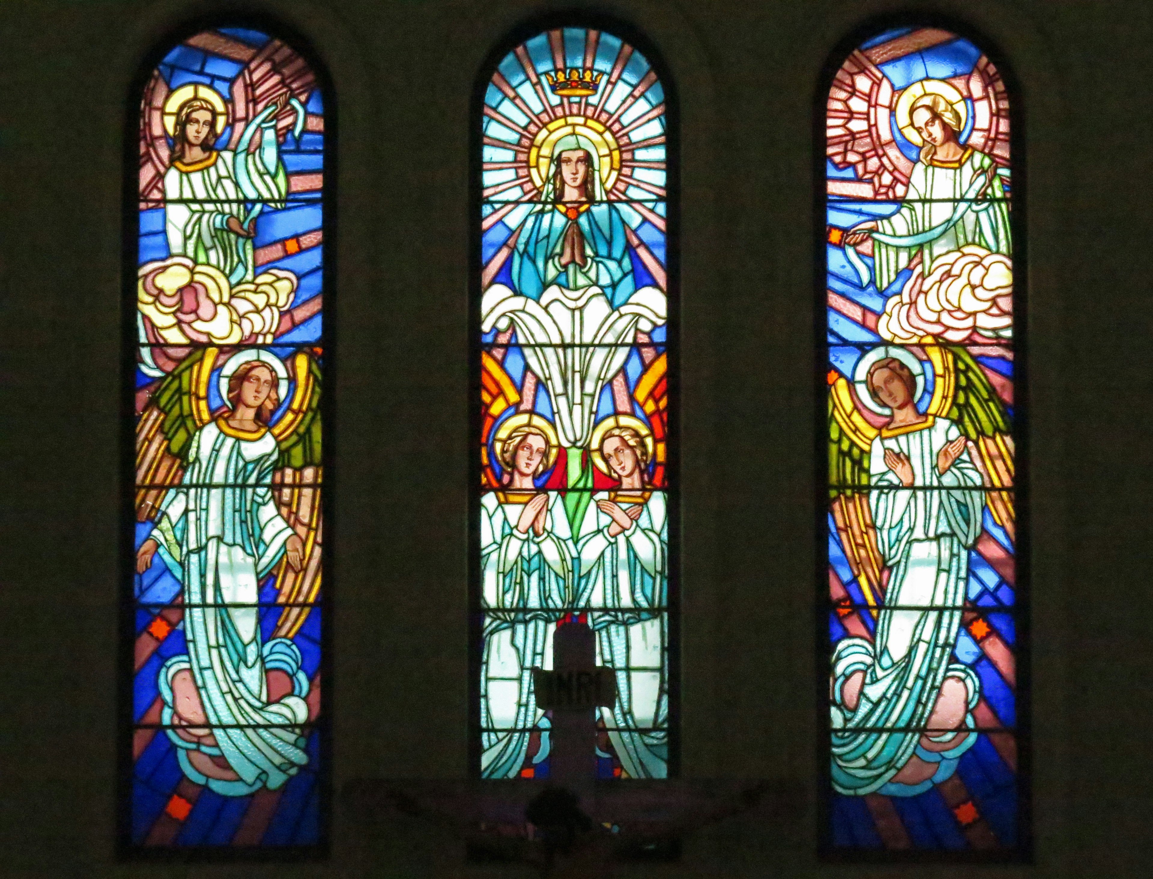 Beautiful stained glass windows depicting angels and the Virgin Mary