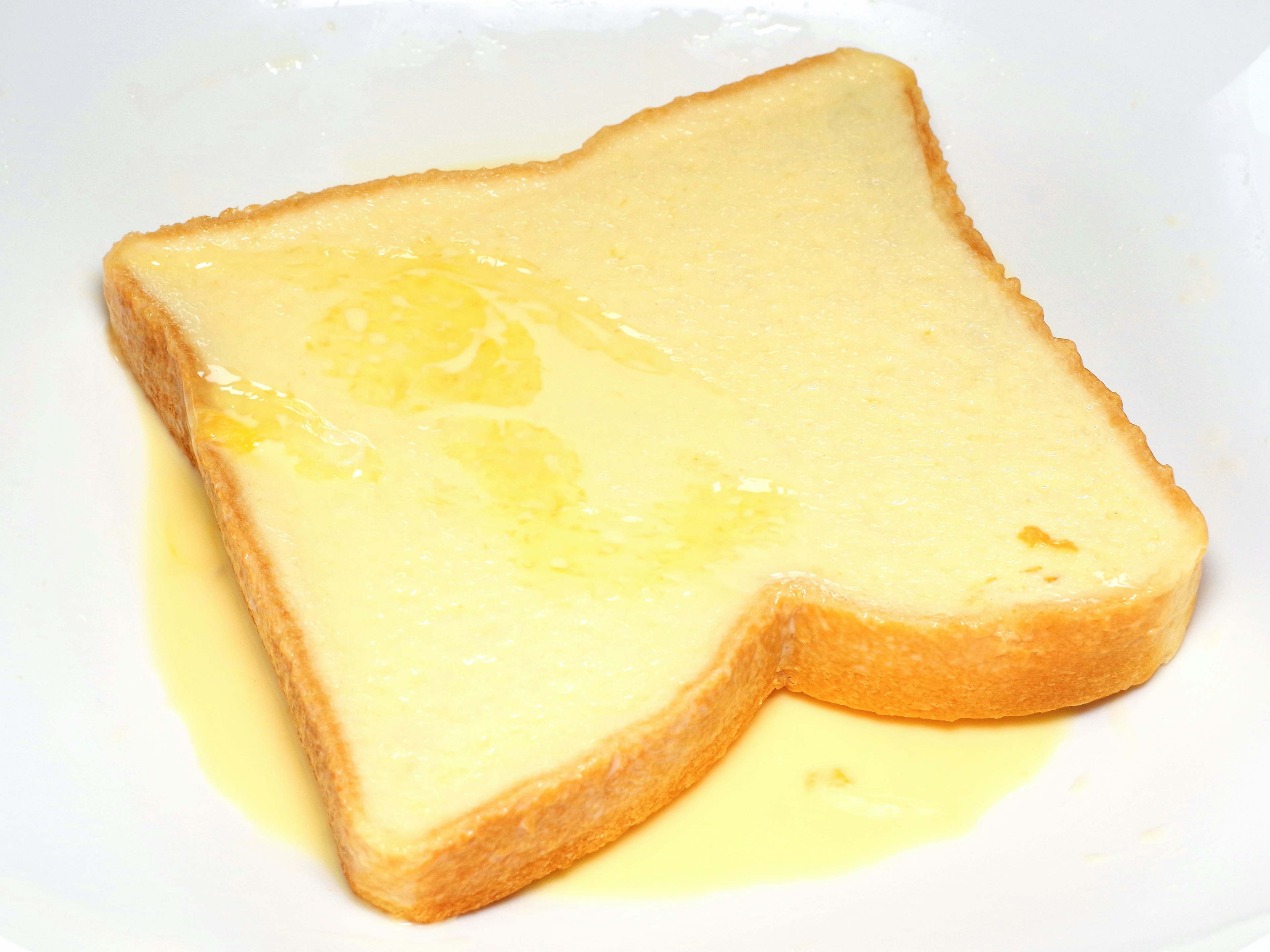 Slice of white bread with melted butter