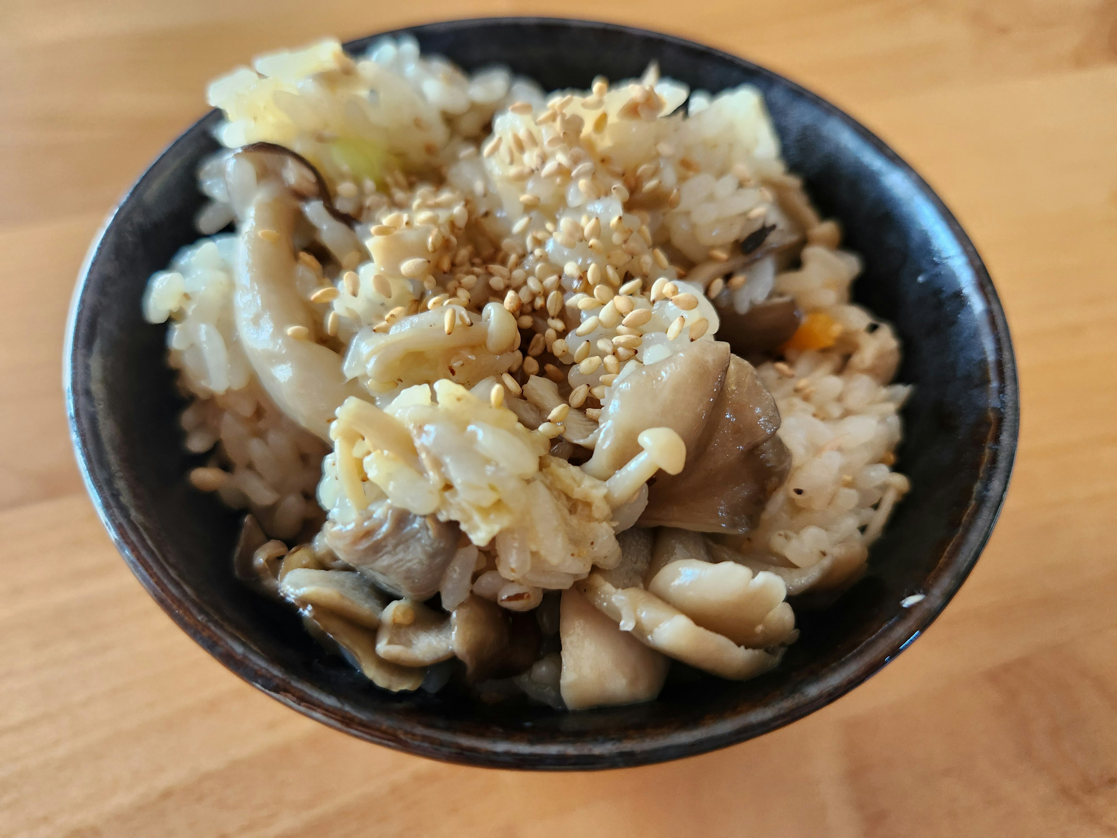 A delicious mushroom rice served in a black bowl