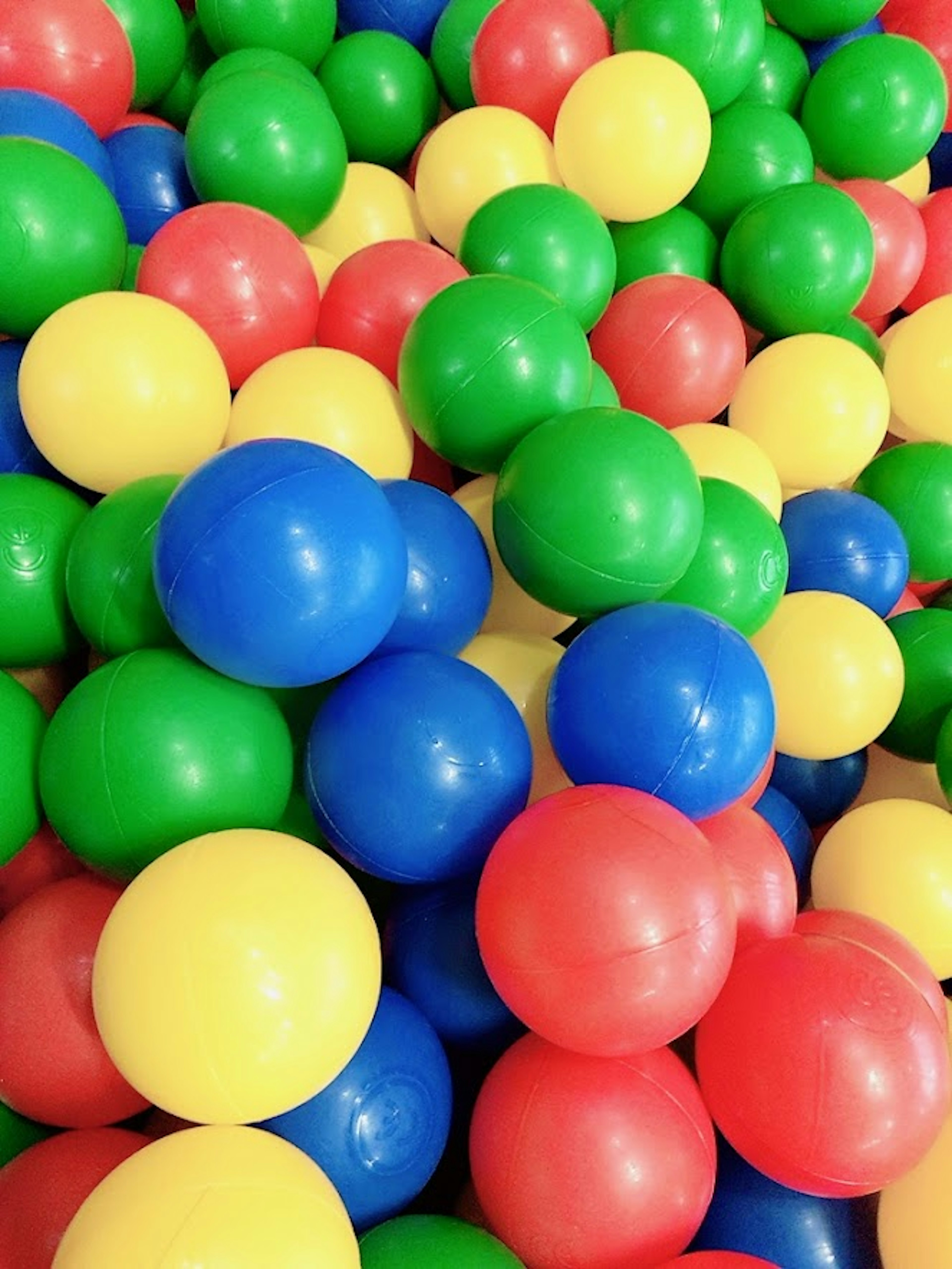 Colorful plastic balls arranged in a pile