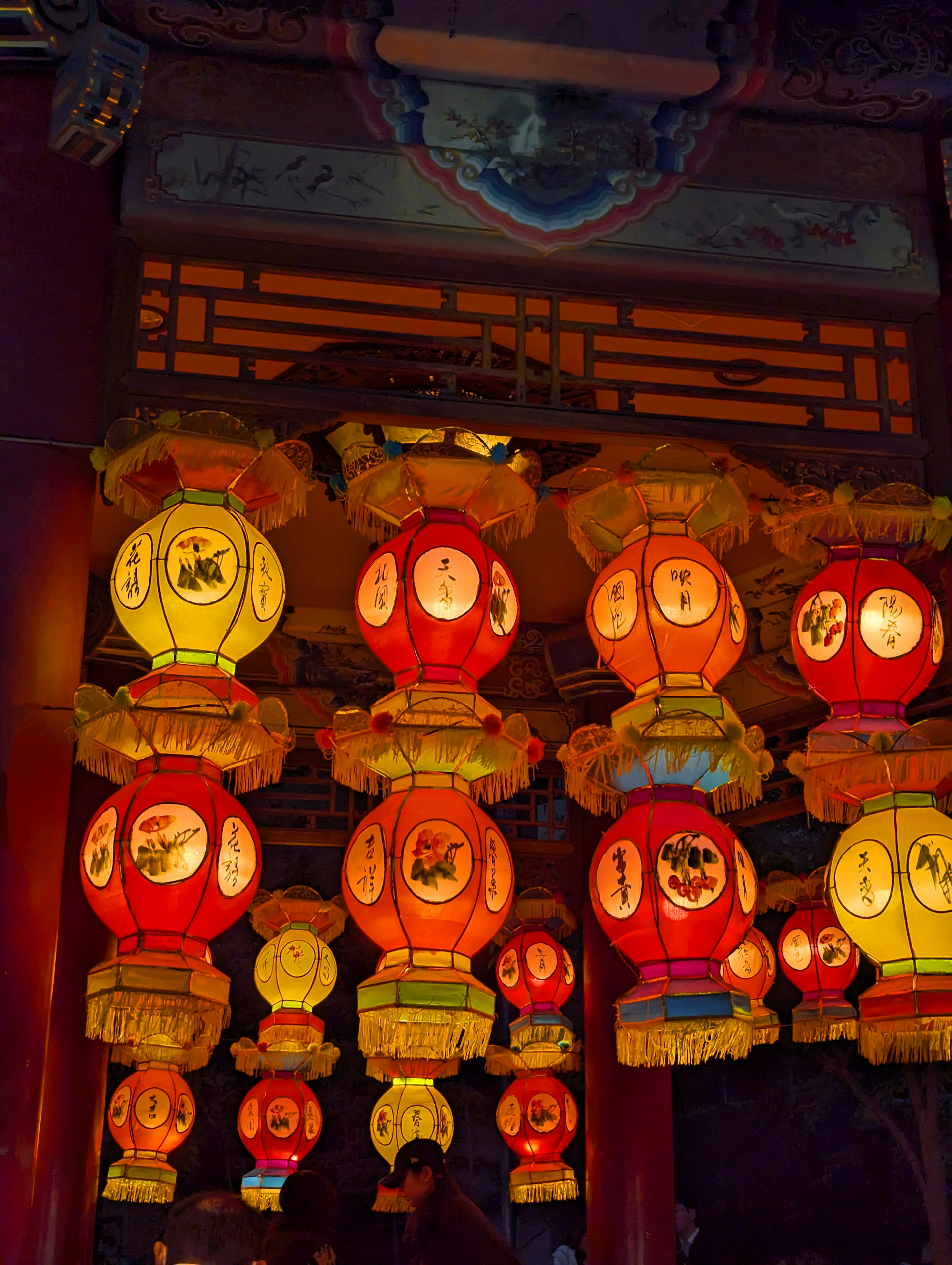 Colorful lanterns hanging in a traditional Chinese temple interior