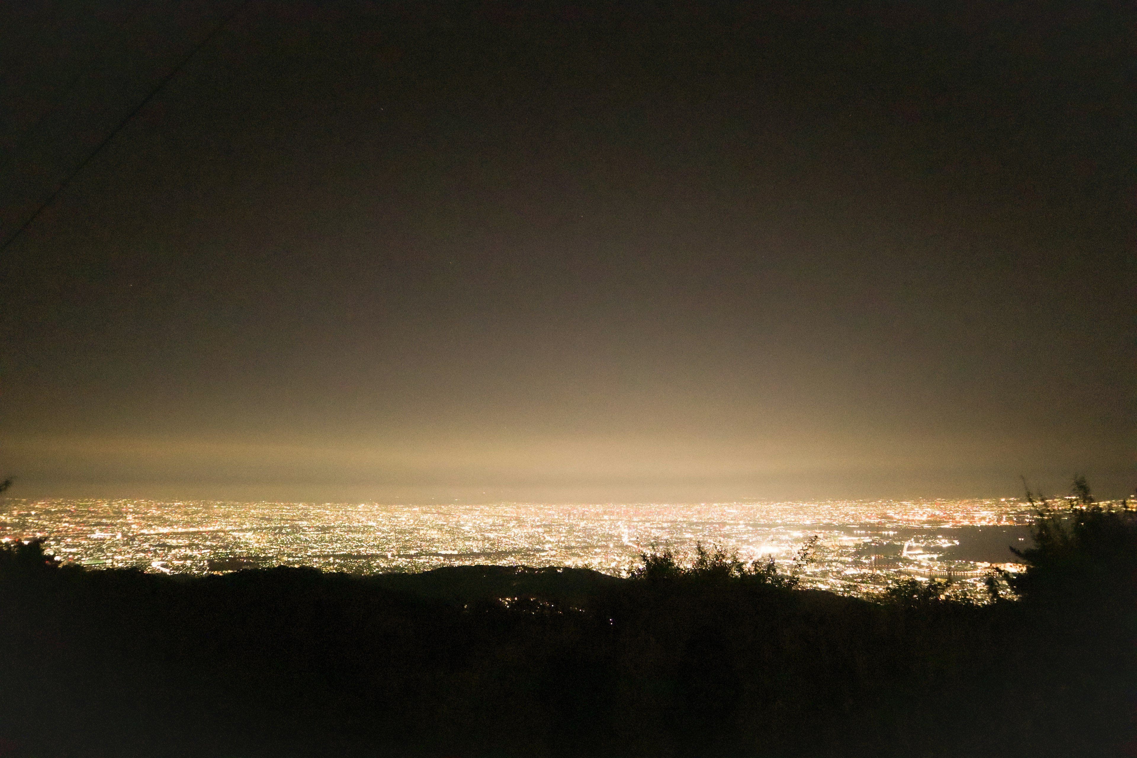 A beautiful night view of city lights stretching across the horizon