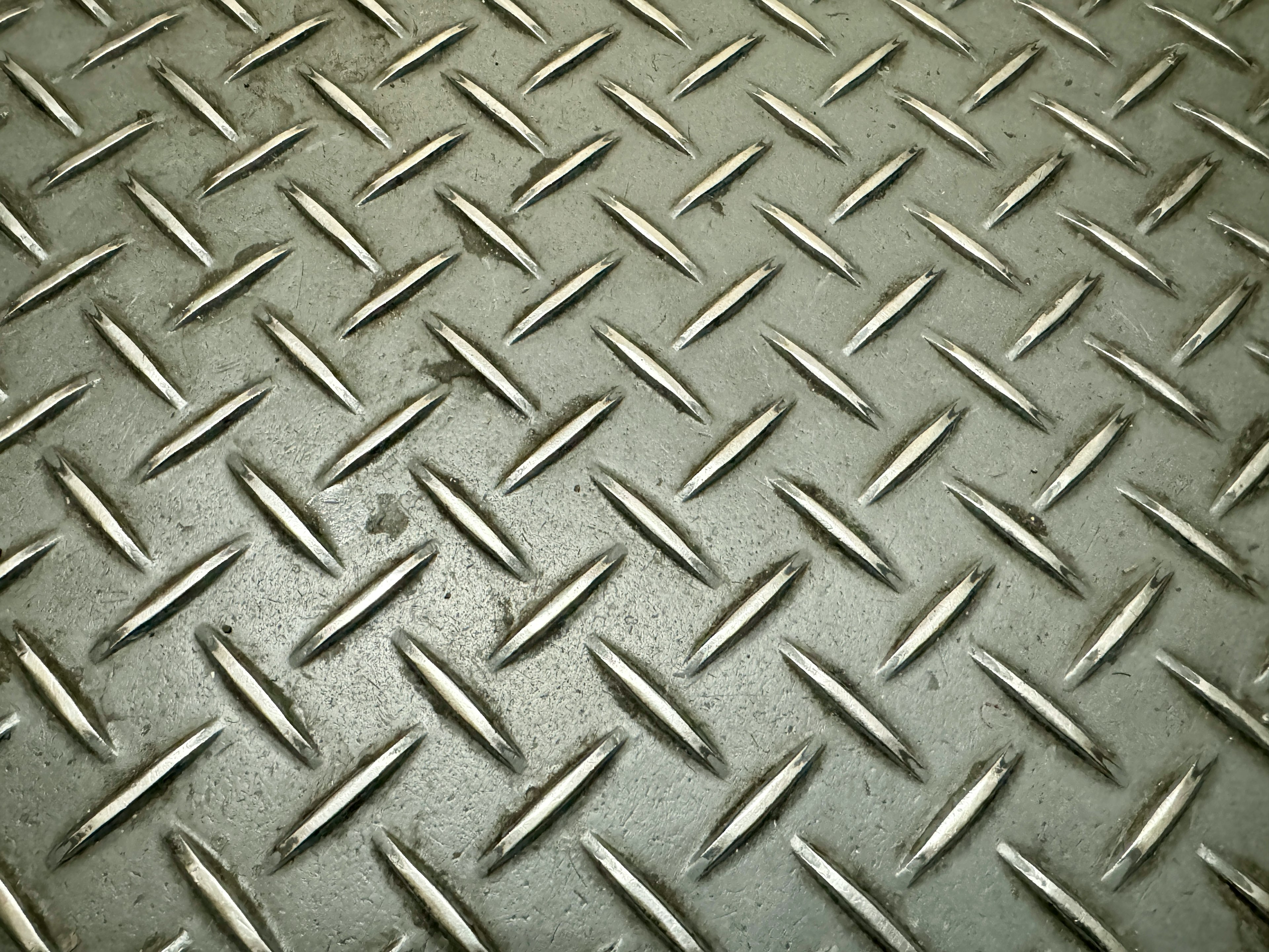 Metal diamond plate texture with raised patterns