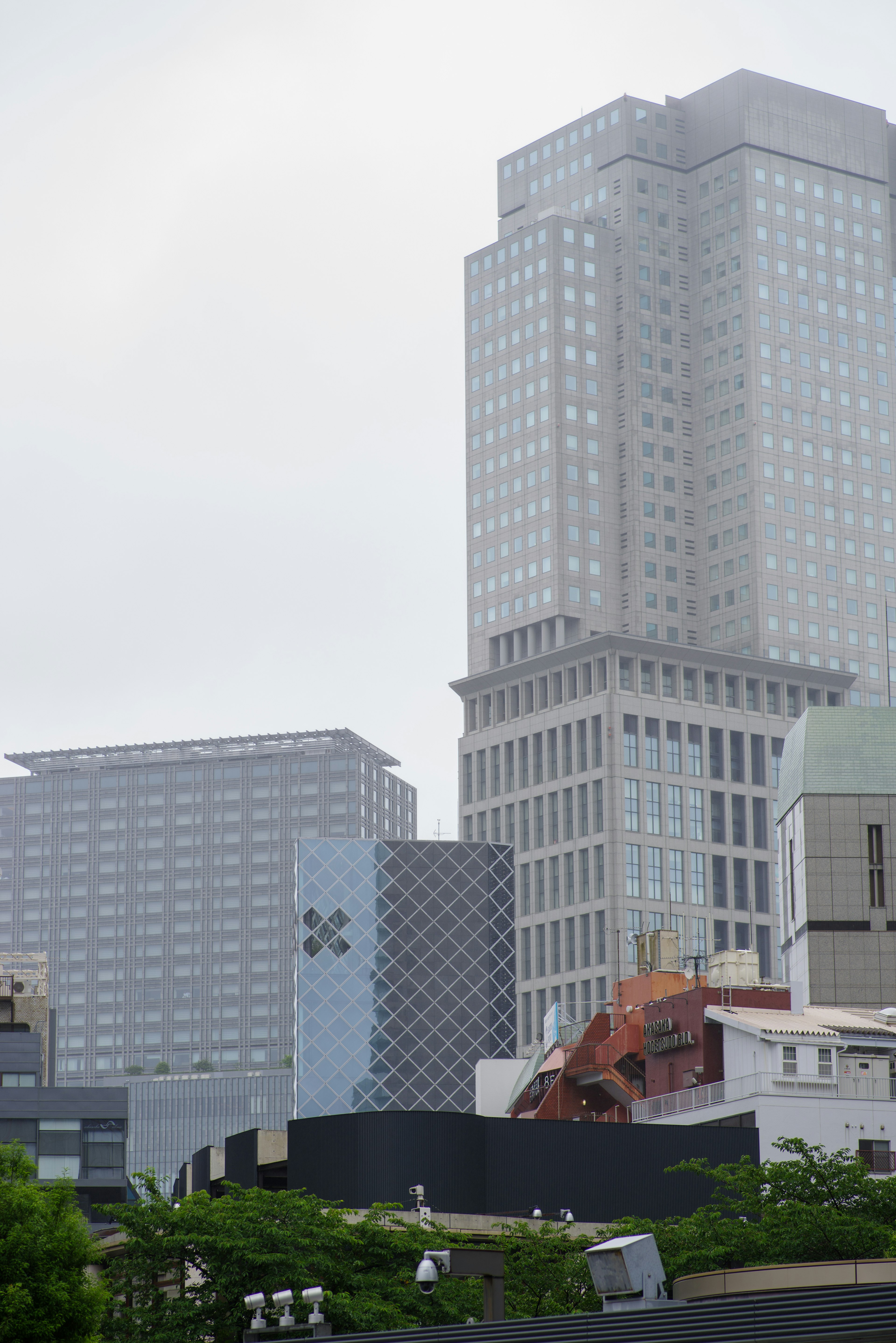 Urban landscape showcasing modern skyscrapers and green park areas