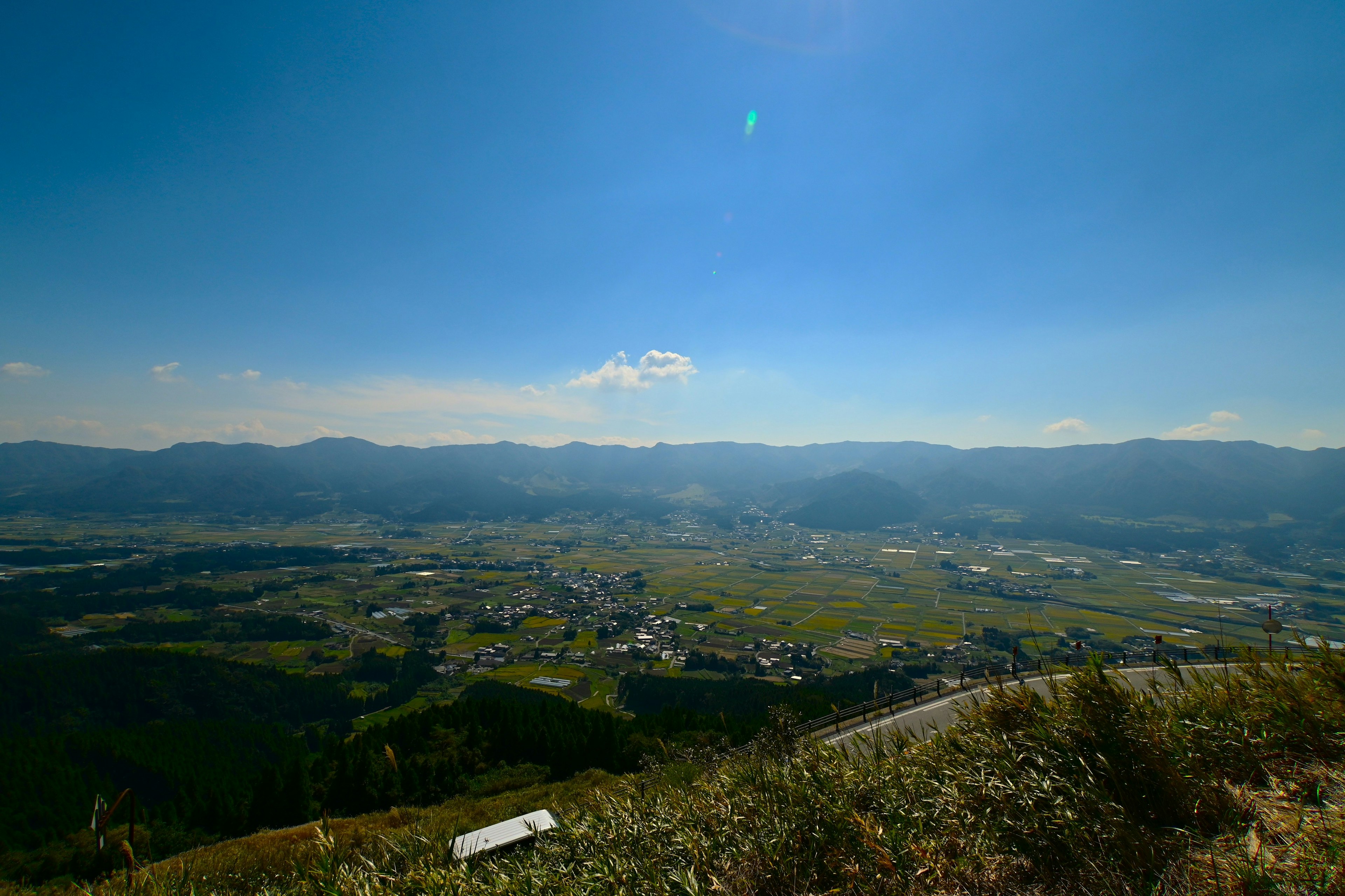 Scenic view from a mountain summit overlooking a vast valley