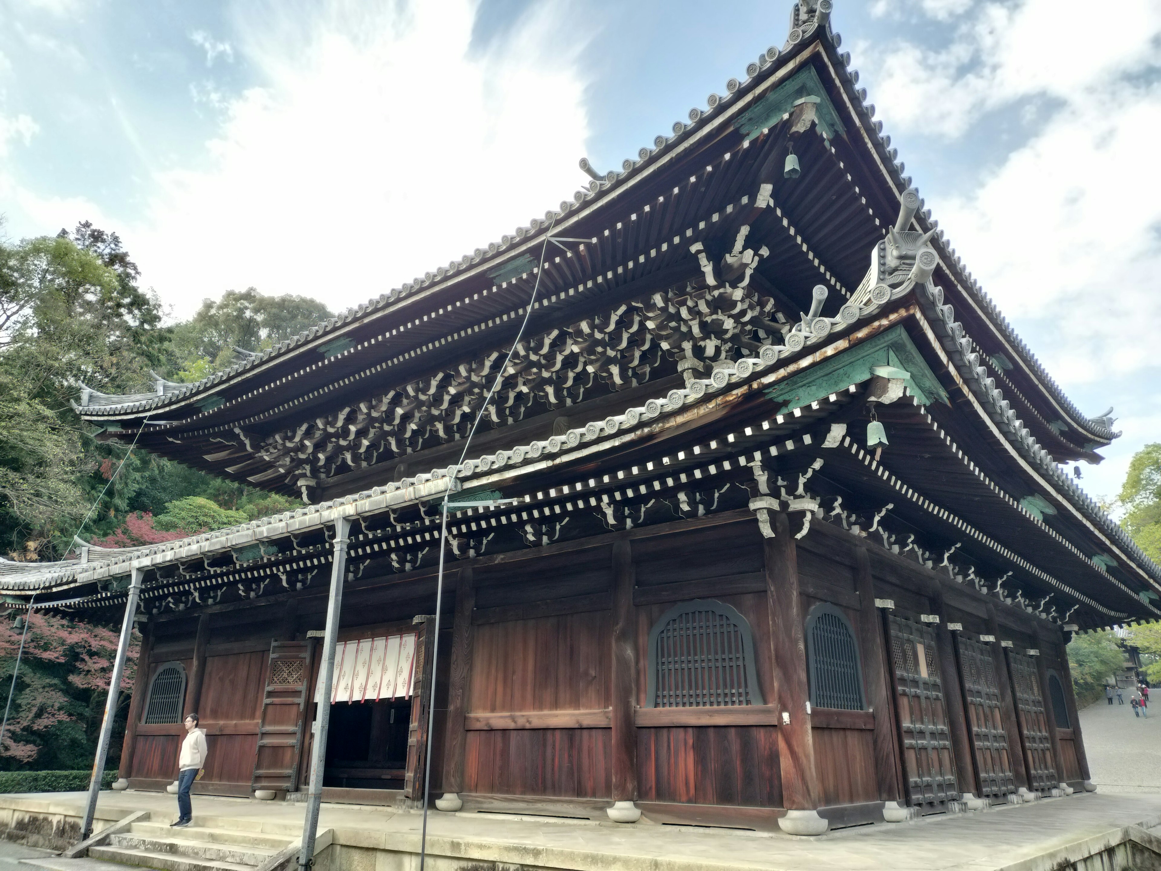 Traditional Japanese temple building with a distinctive upward-curving roof