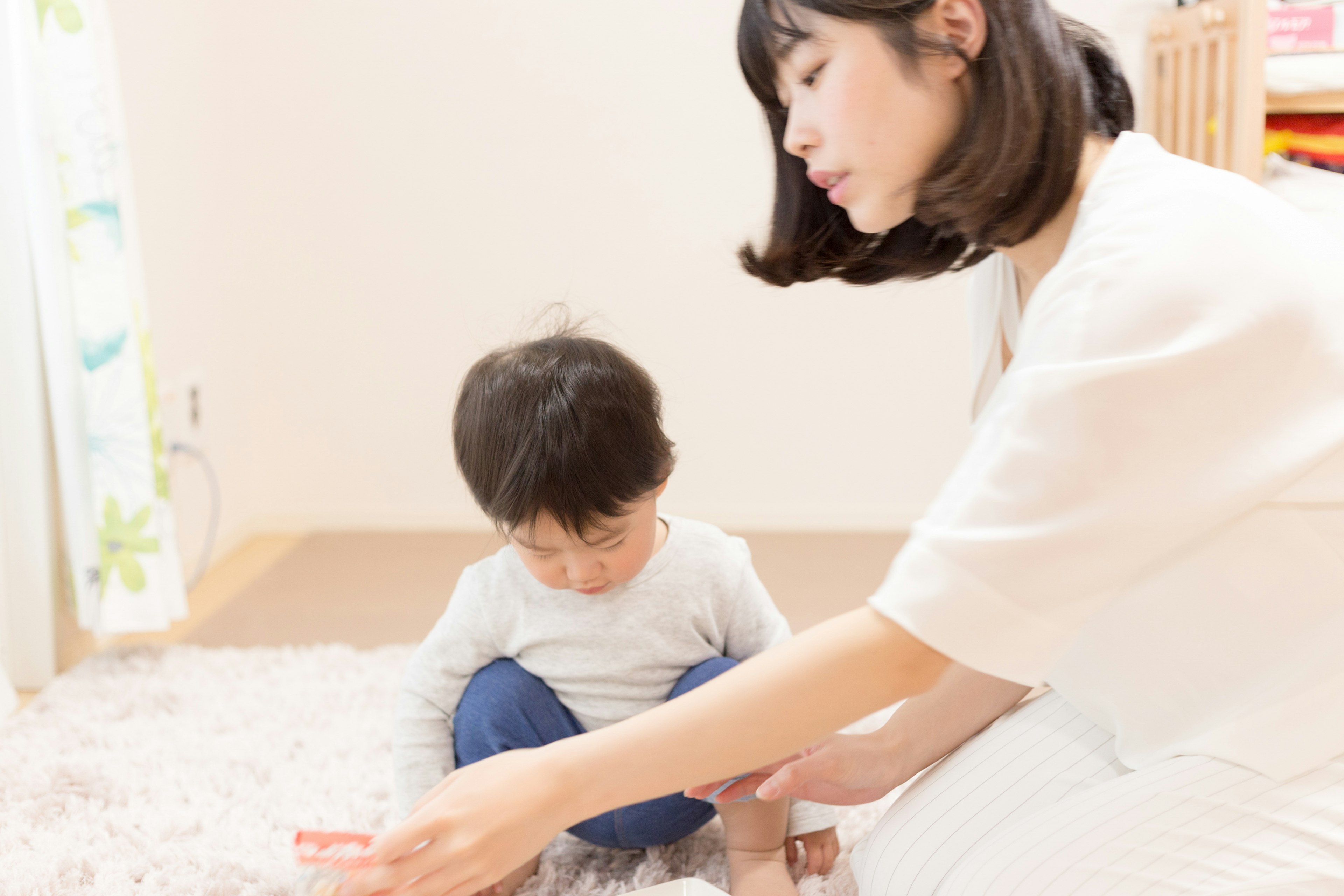 A mother engaging with her child in a cozy home setting