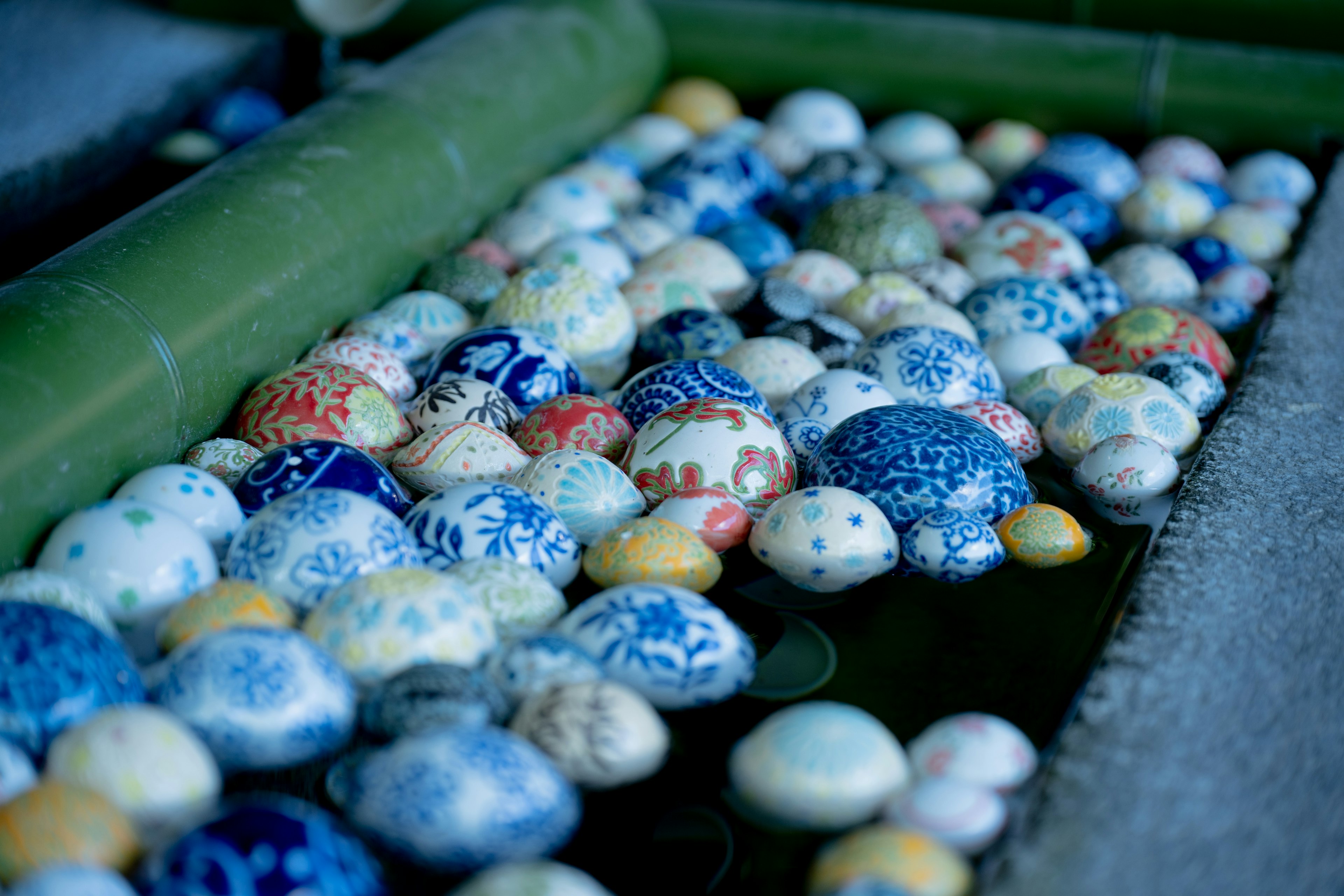 Colorful patterned eggs floating on the water surface