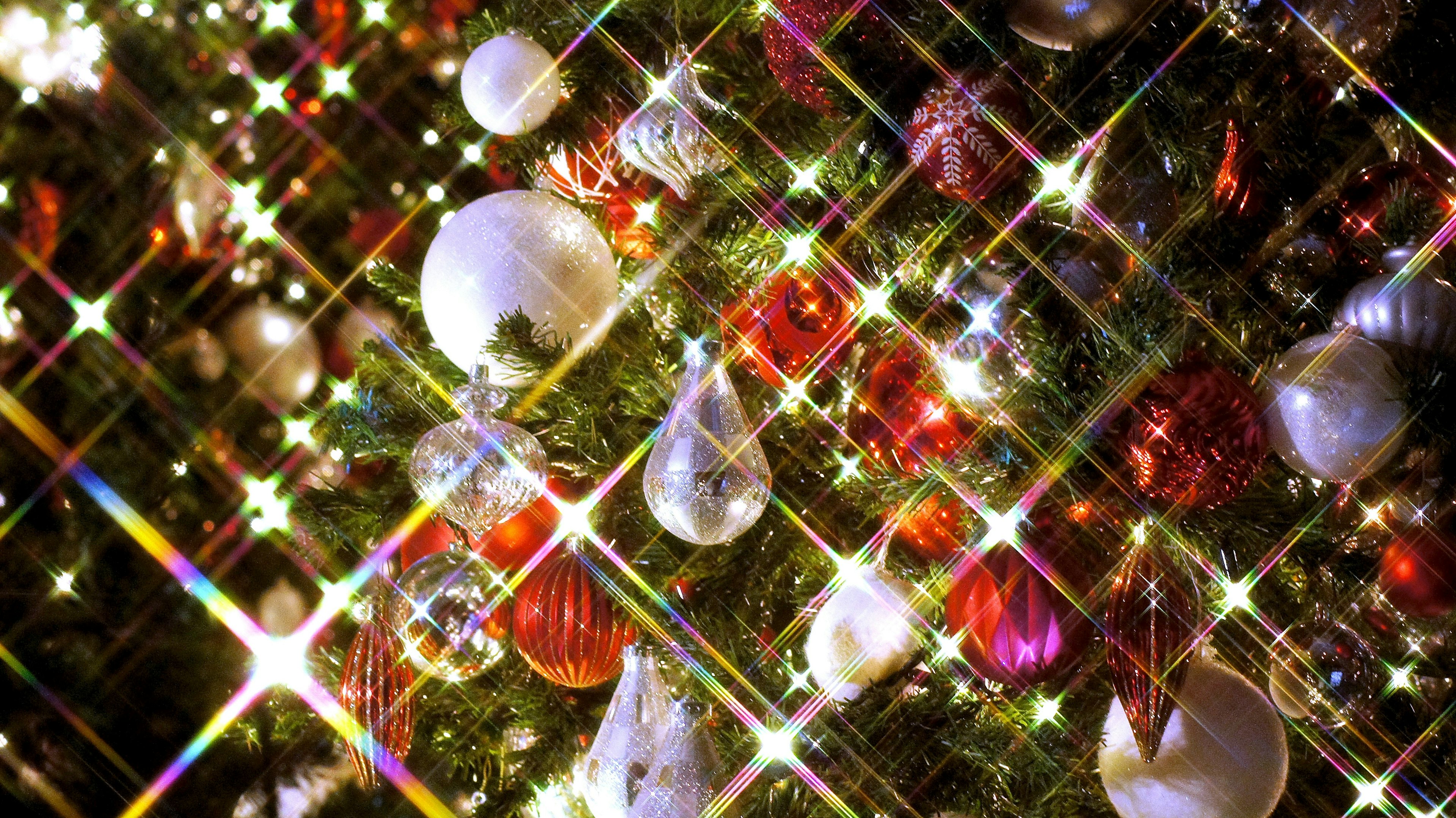 Beautiful sparkling ornaments and reflections on a Christmas tree