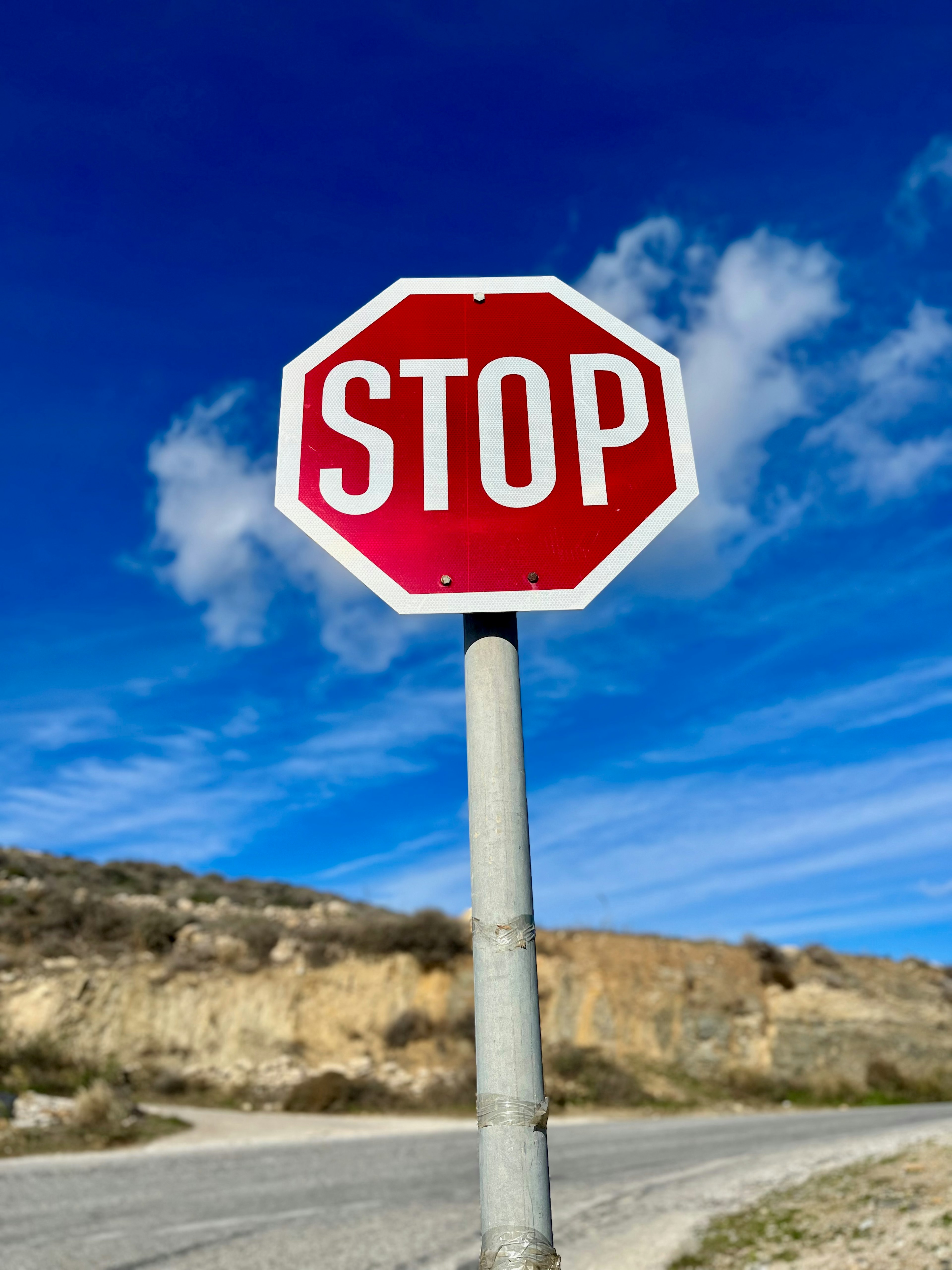 Red stop sign against a blue sky