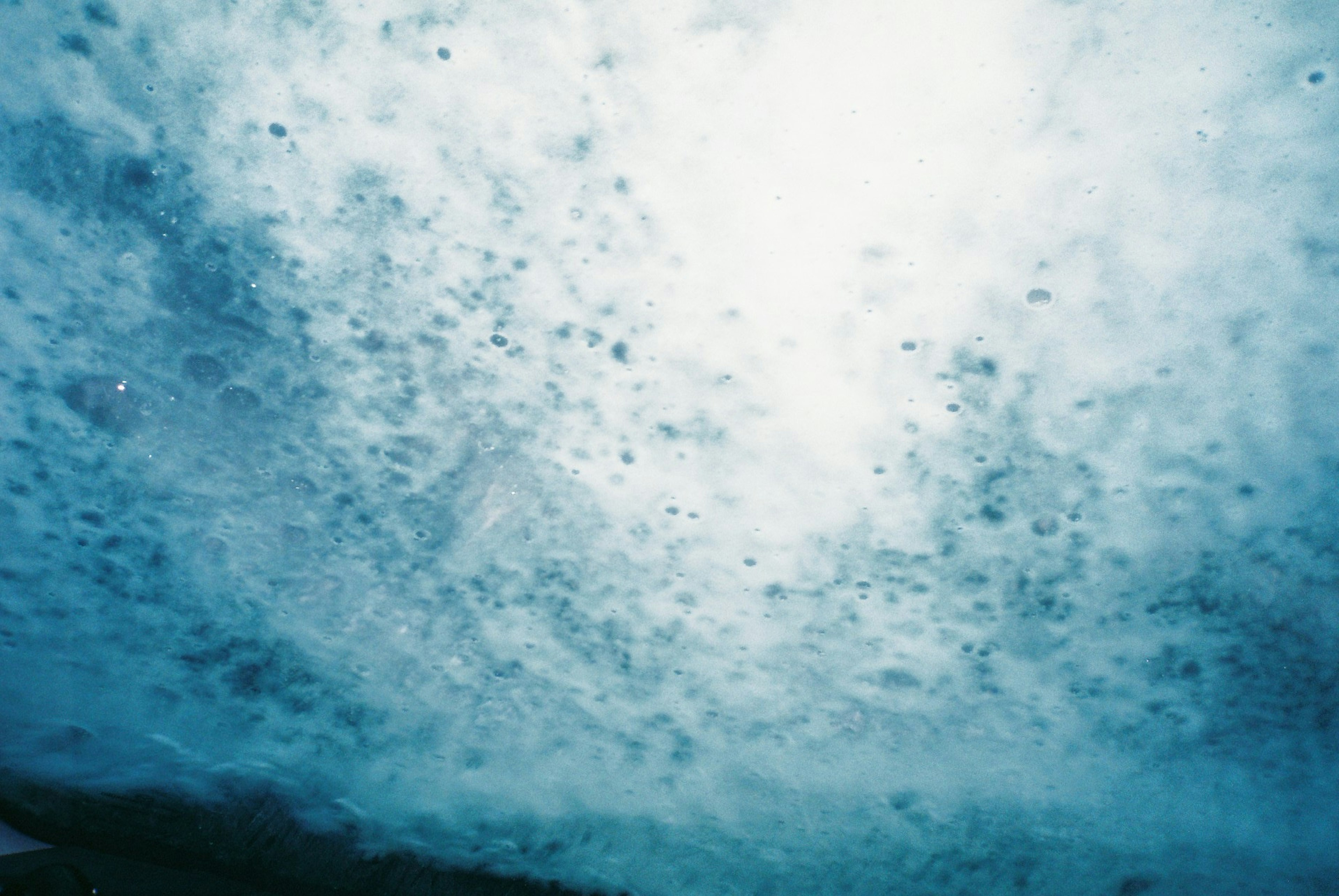 A beautiful underwater scene with blue bubbles and water patterns