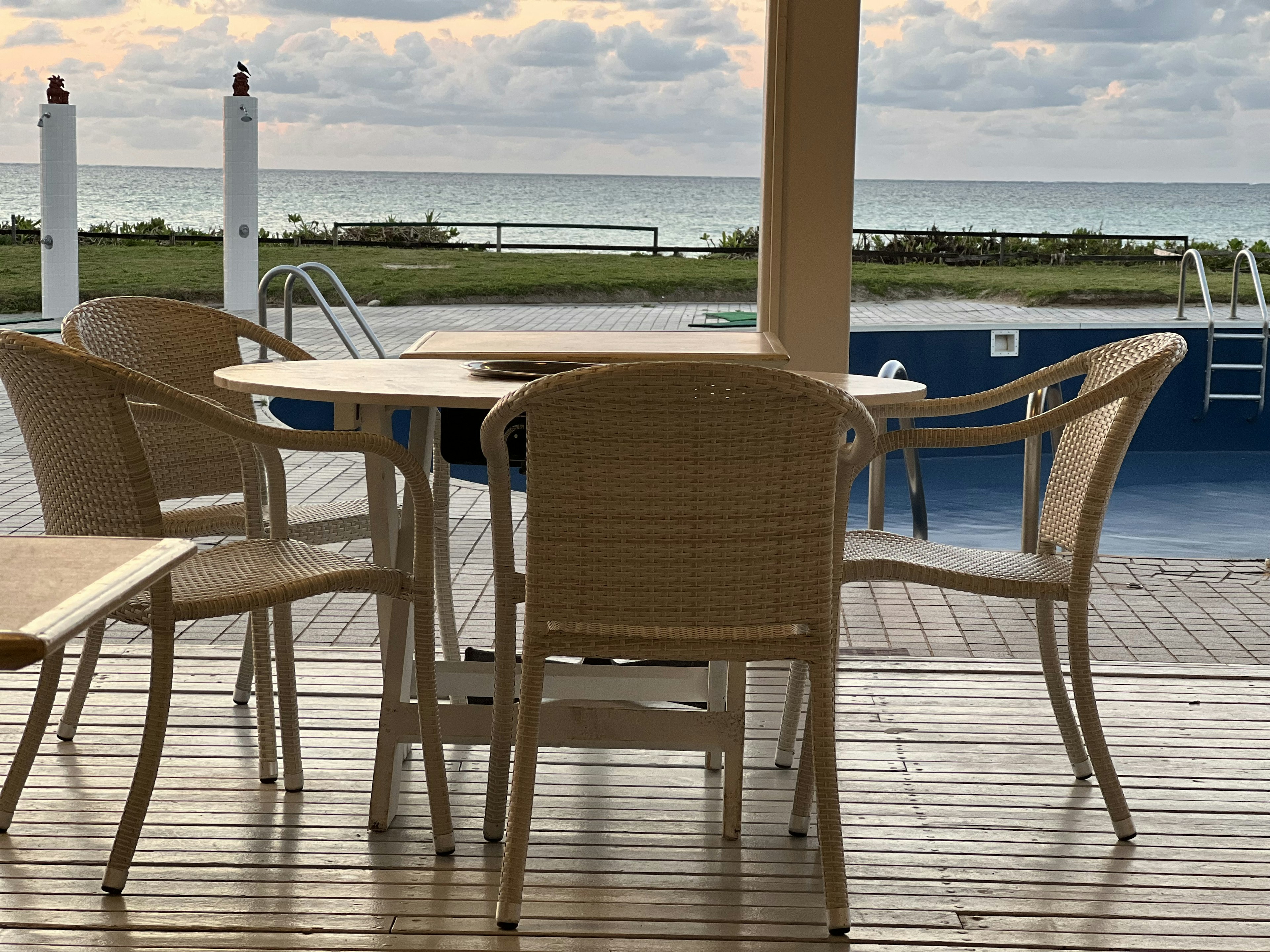 Table and chairs on a terrace overlooking the sea