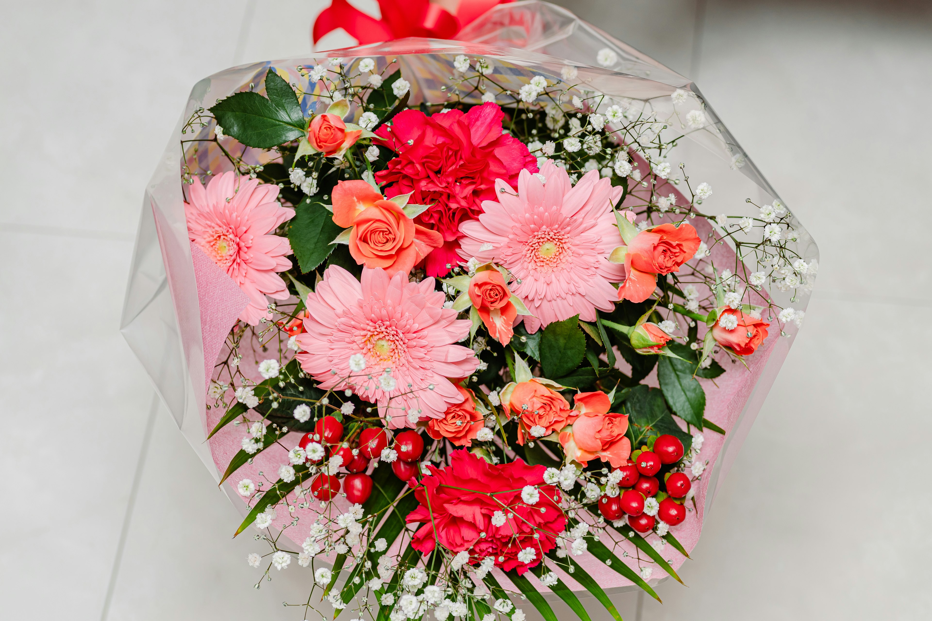 Colorful bouquet featuring abundant pink and red flowers