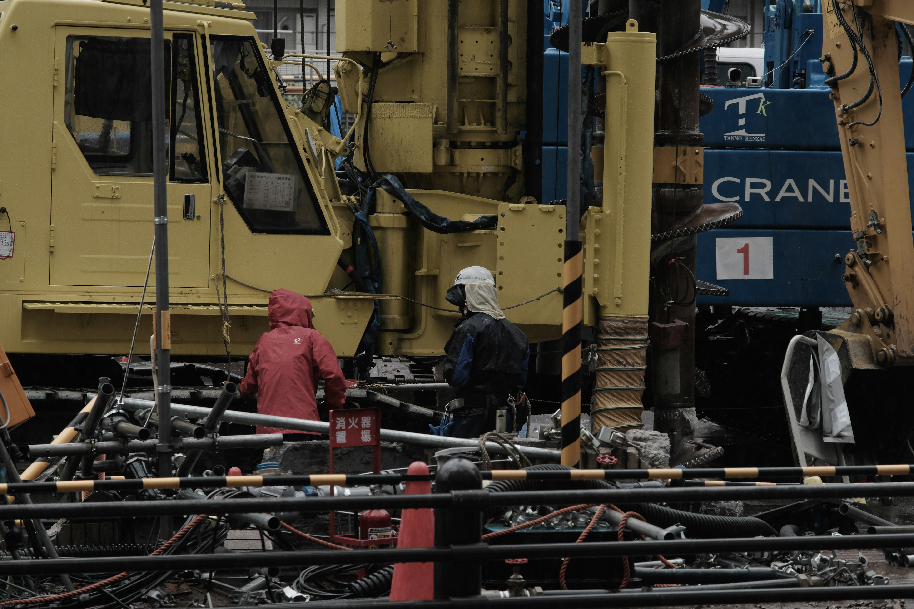 Construction site with workers and heavy machinery