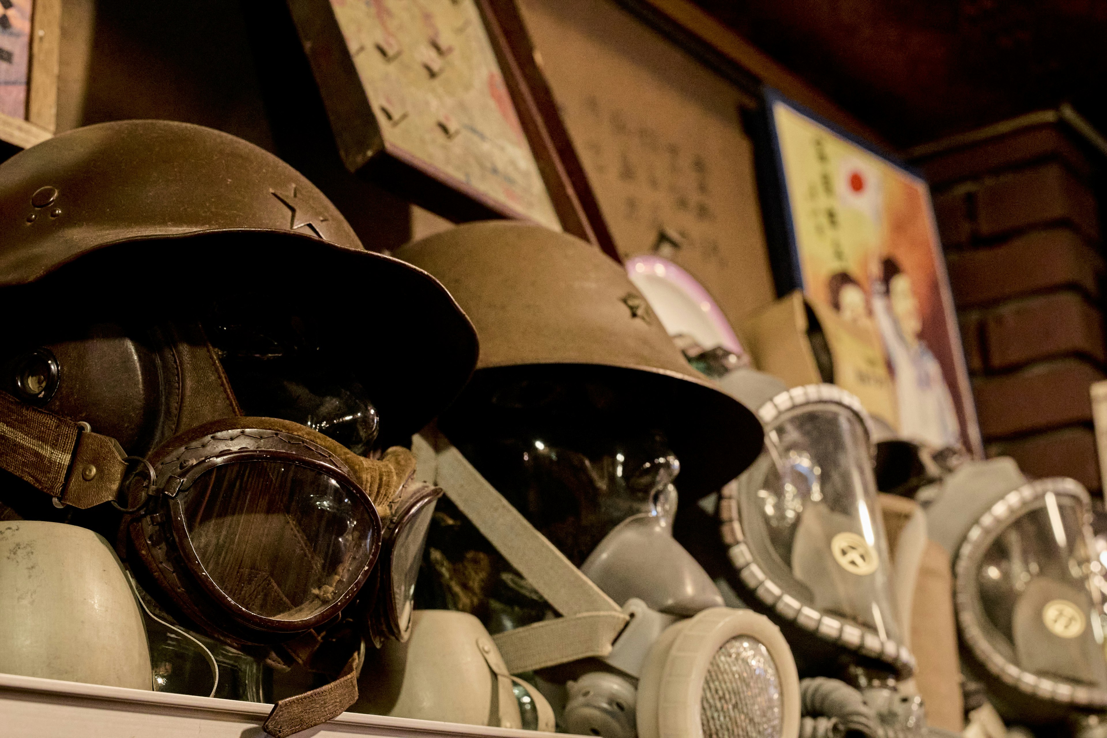 Historical display of military helmets and gas masks