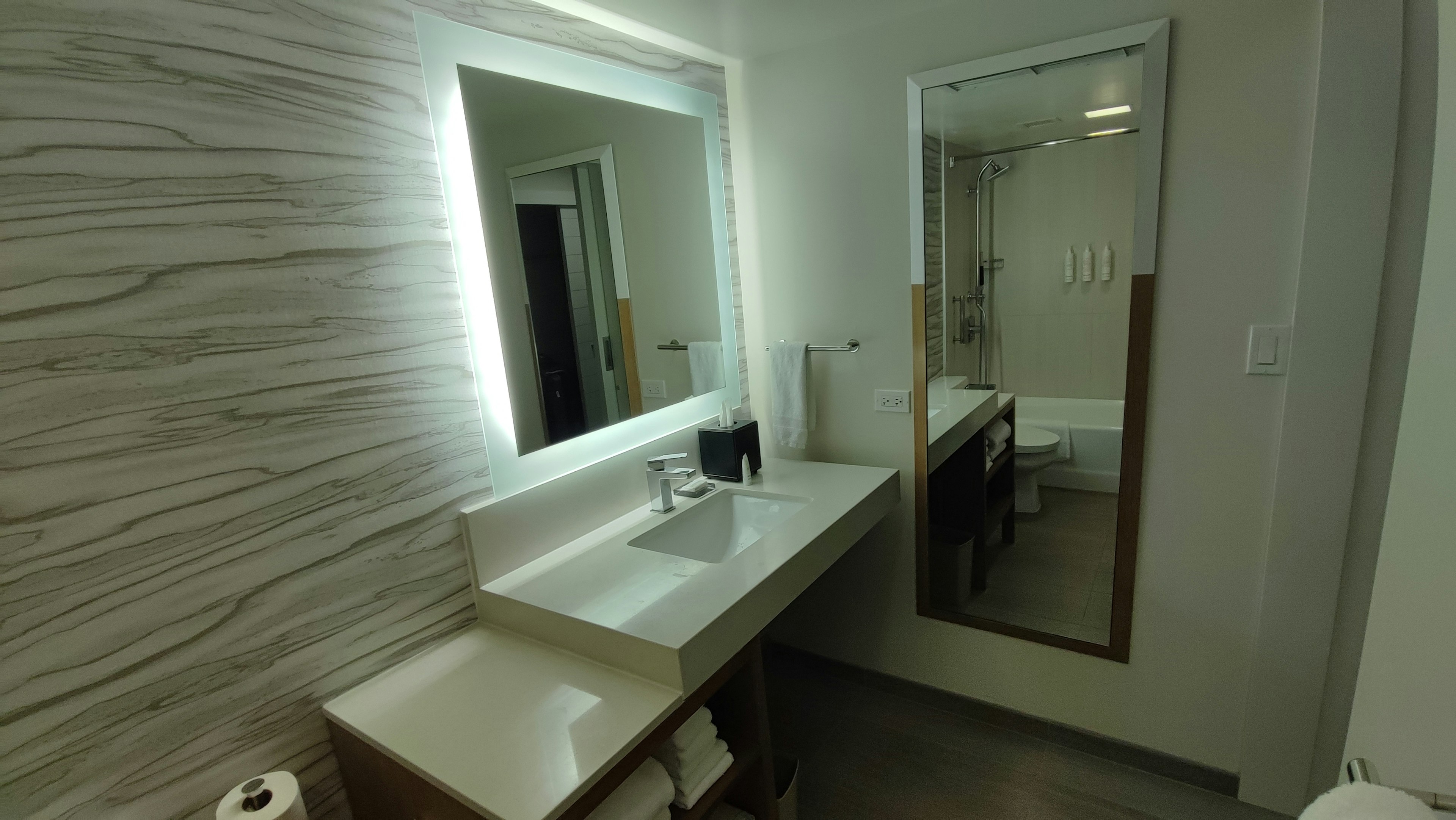 Modern bathroom interior featuring a sink and mirror