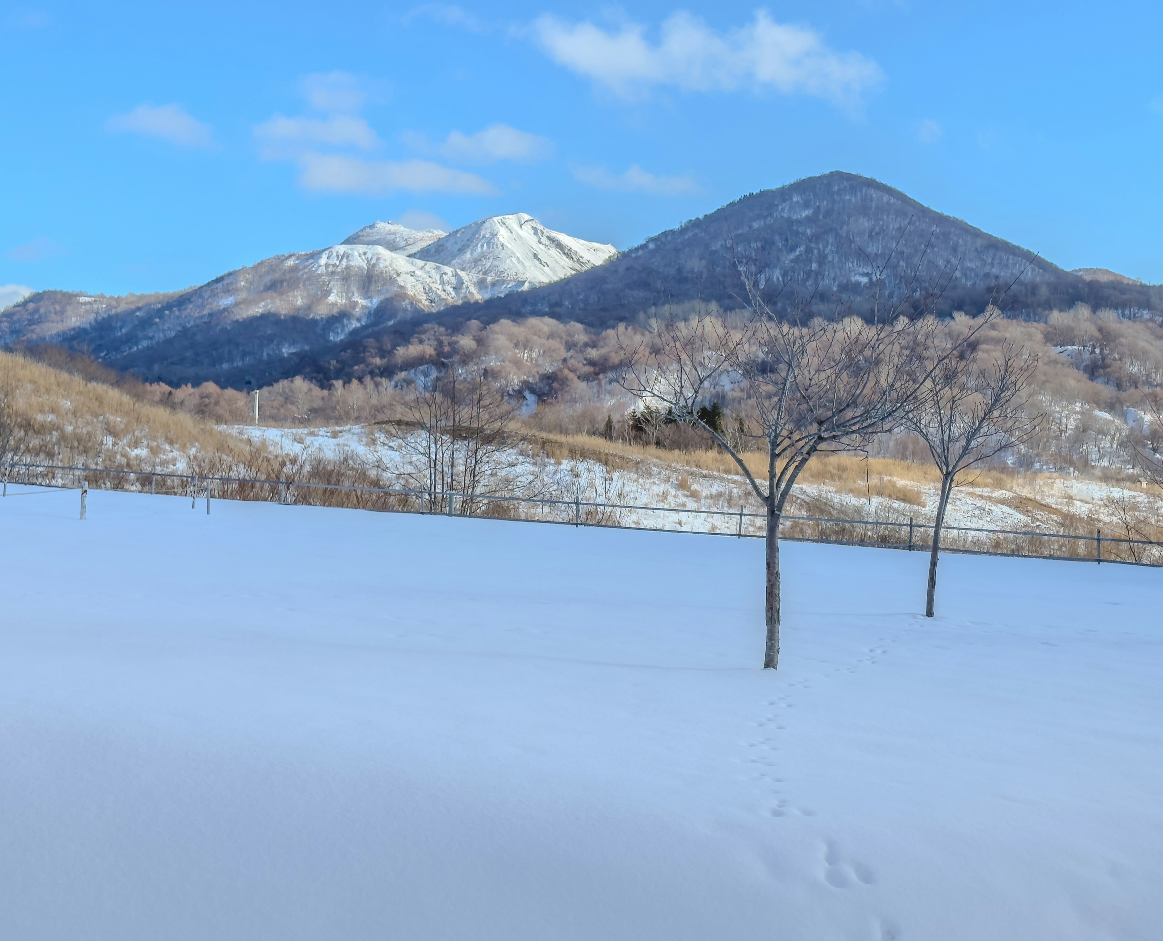 Snow-covered landscape with beautiful mountains in the background