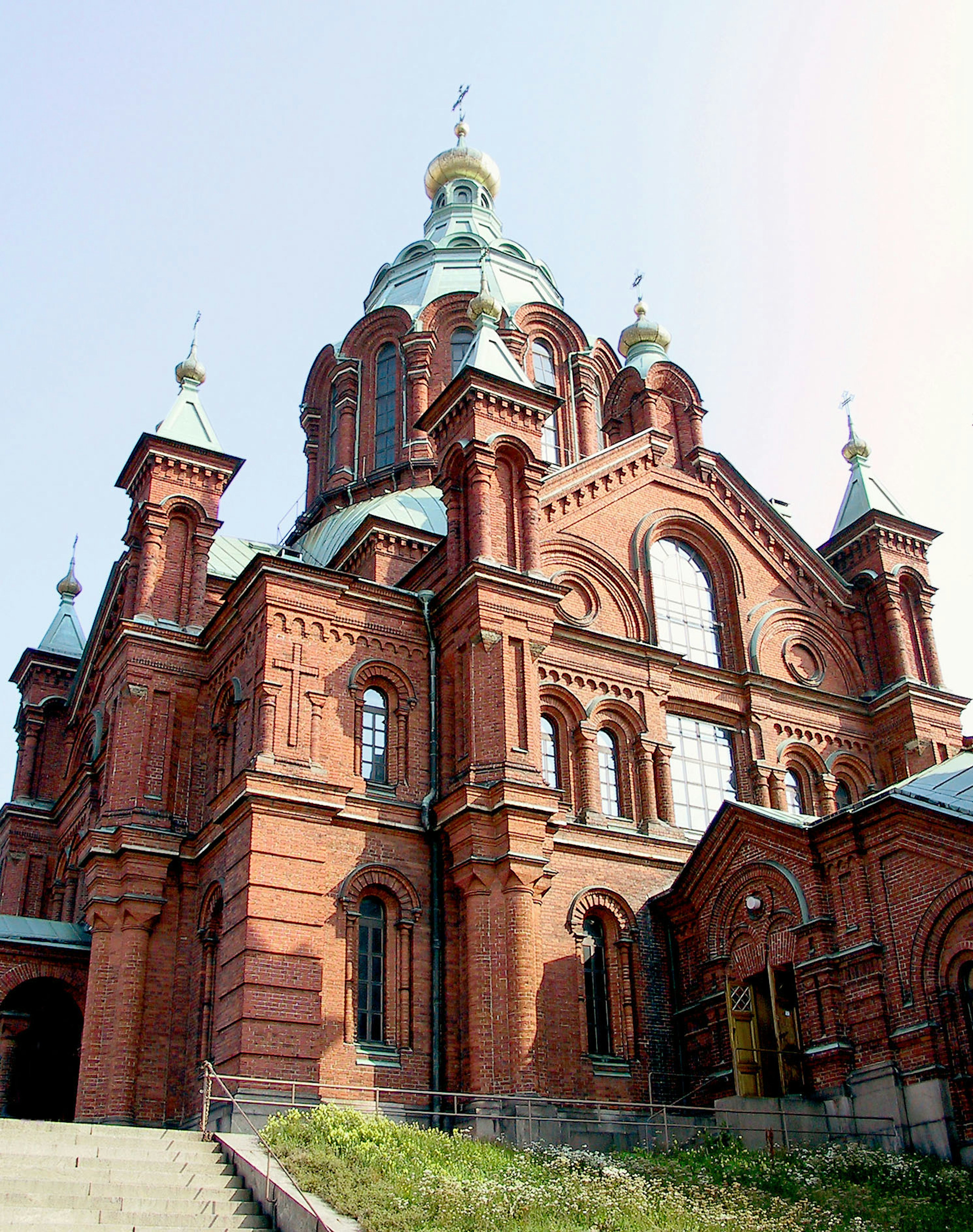 Stunning red brick church with a prominent dome