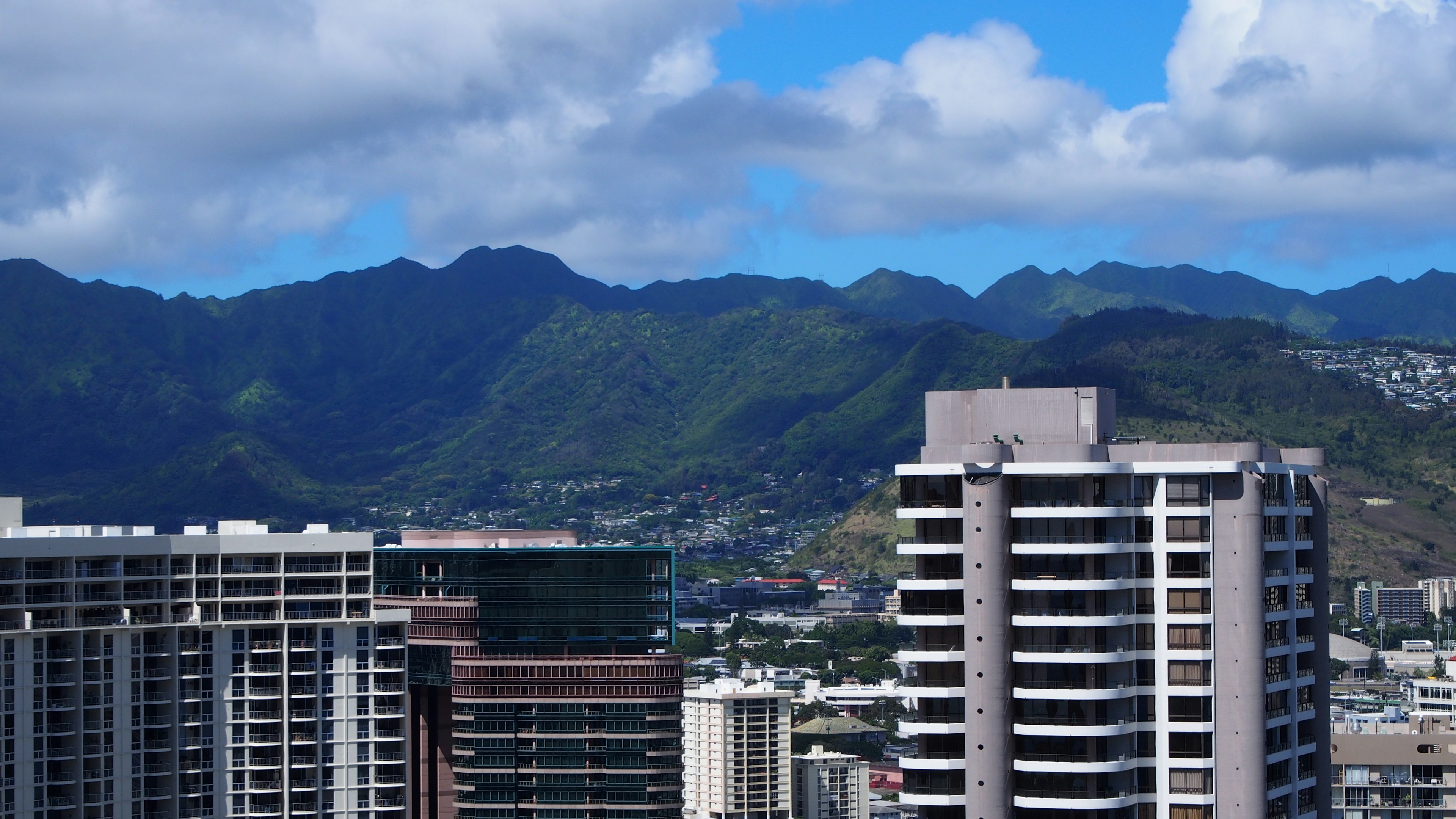 Urban skyline with mountains in the background