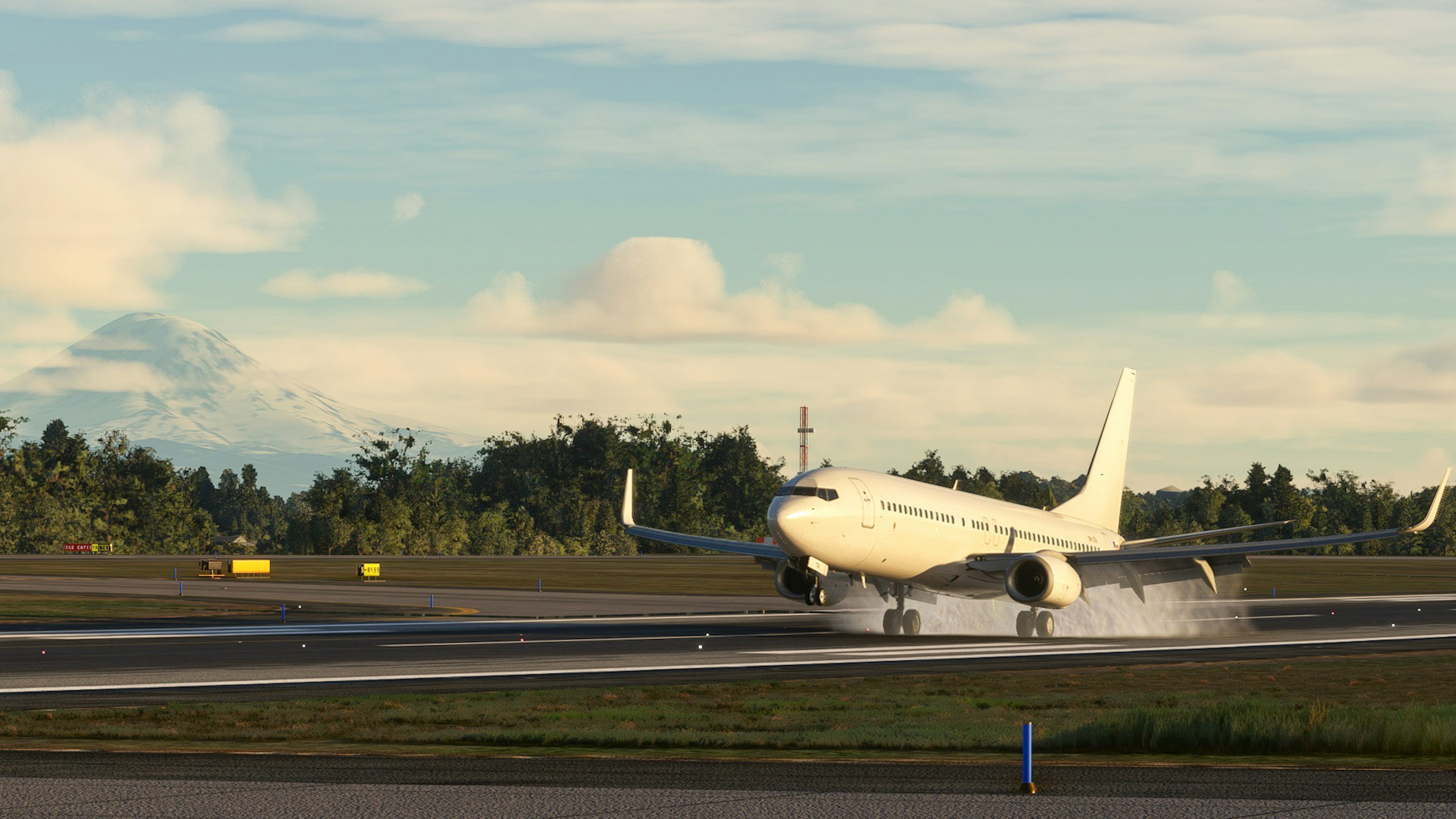 White airplane landing on runway with blue sky